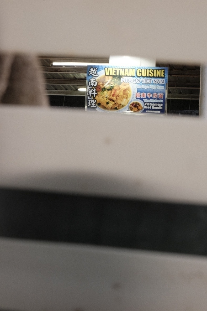 There's even a Vietnamese pho place, beef scoop, what else. (Only a handful of the 20 shops have veg options). This image is shot through a chair that works as a frame