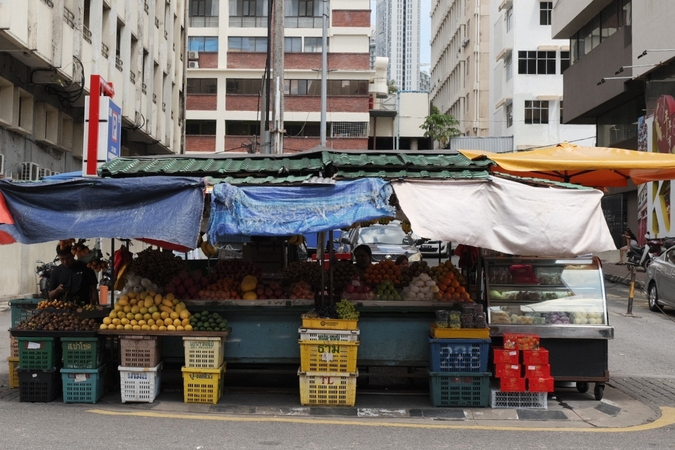 Shot on the street, vegetables in between vintage Chinese high risings. Colourful boxes 