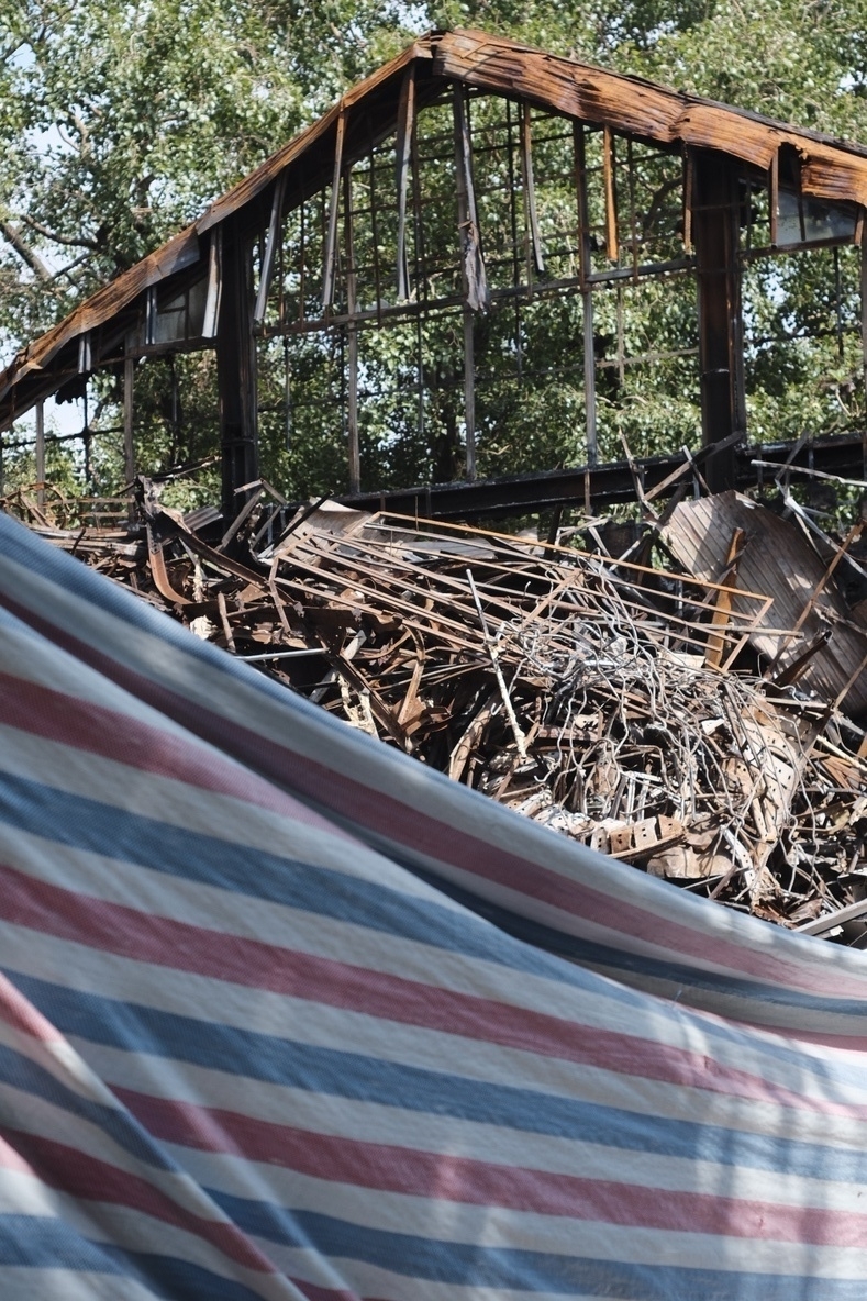 A destroyed old building close to the old down. It probably was broken before the typhoon went through Hanoi, but the debris looks fresh. A large collapsed roof 