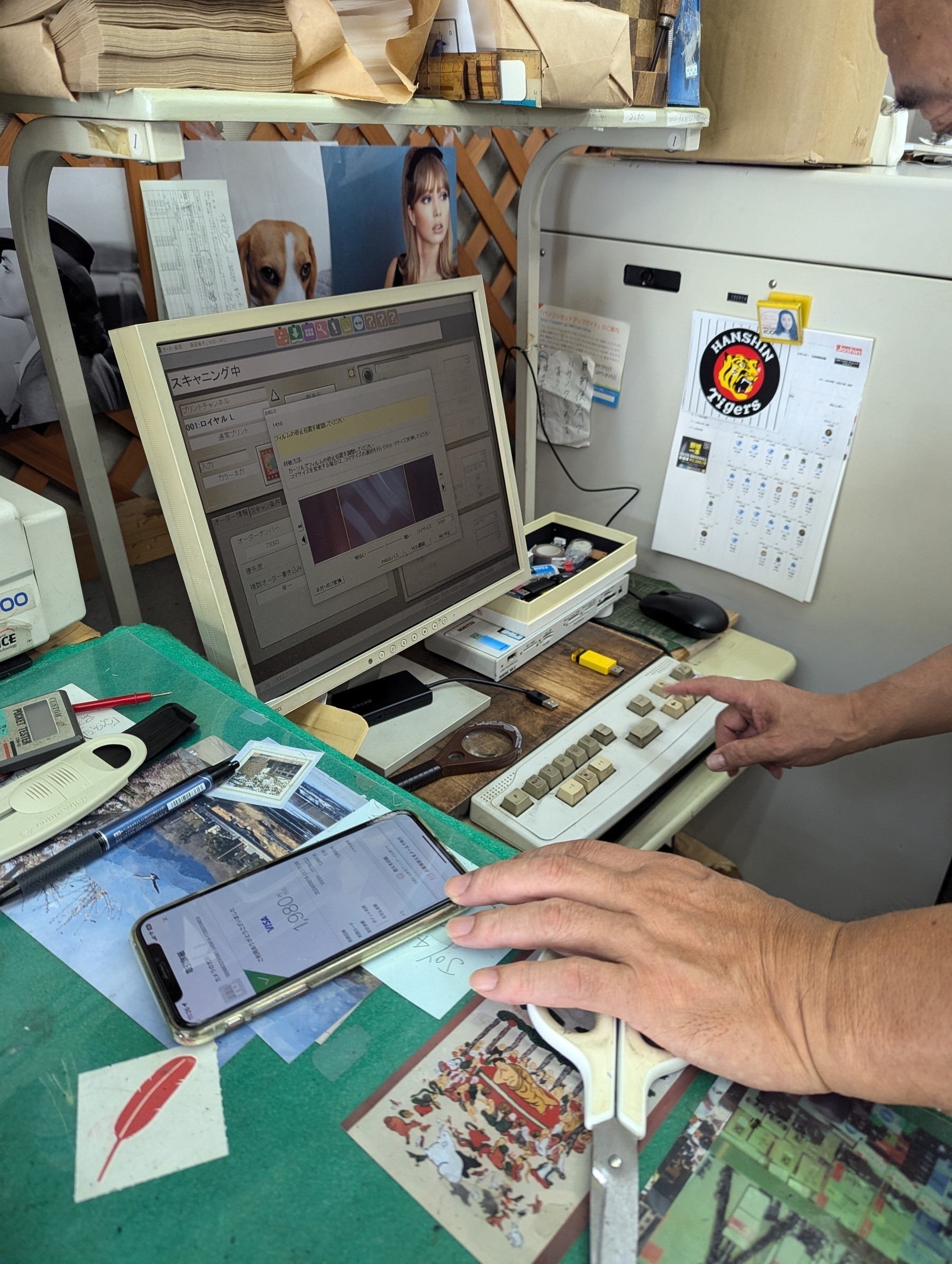 A very unique computer setup to serve me a bill, including a keyboard that only has about 16 keys, a very old grey one. You see the hands of the clerk typing 