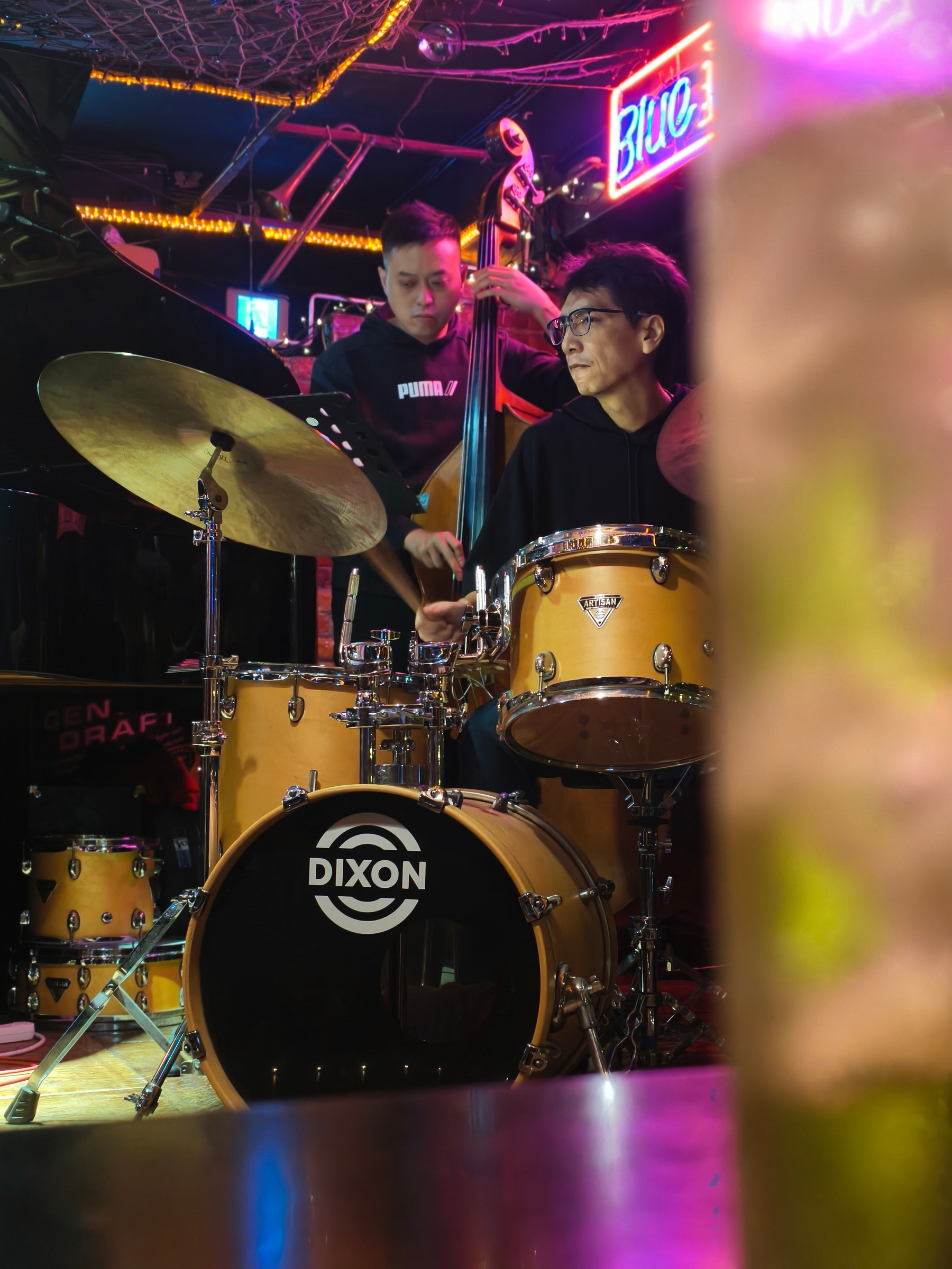 A picture from Jazz night, drummer and vase in focus..