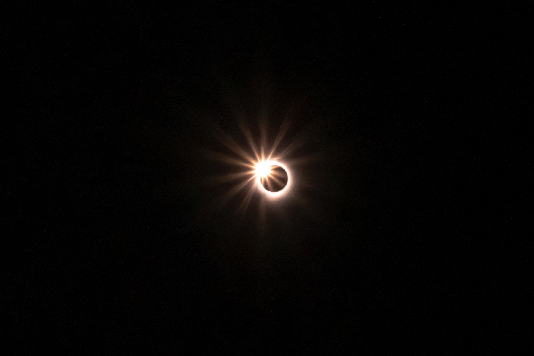 The stage of the eclipse known as the "diamond ring" a second or two before totality. This is where the sun is almost completely occluded by the moon, with a brilliantly bright "diamond" at one edge. 