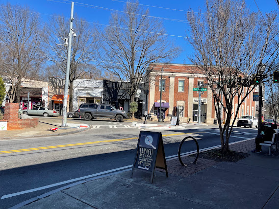 Inner-city Atlanta has sidewalks and a connected street pattern for people to walk. Cars are forced to drive slower due to narrow roads. Everything is close by.