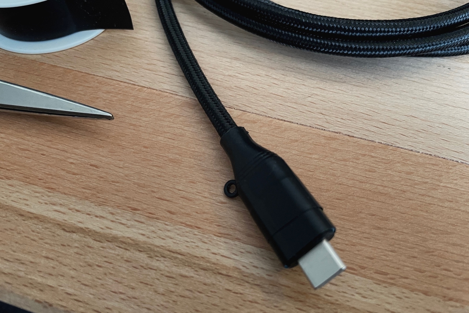 USB-C plug with the ugly color covered with insulating tape