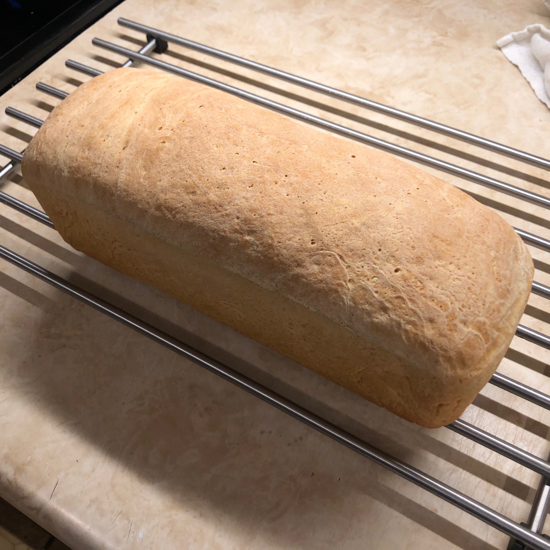 Loaf of bread cooling.