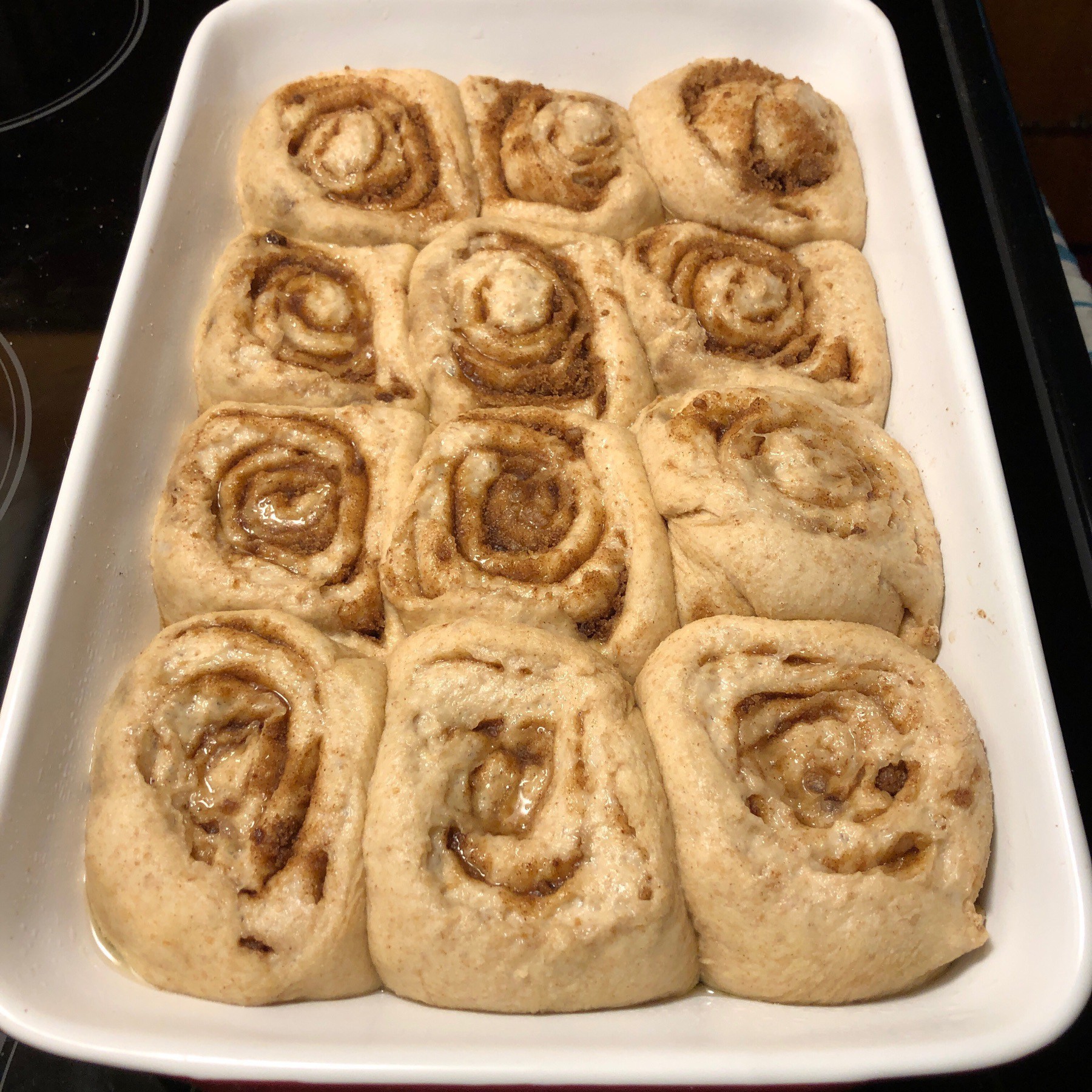 Cinnampn buns in pan after rising.