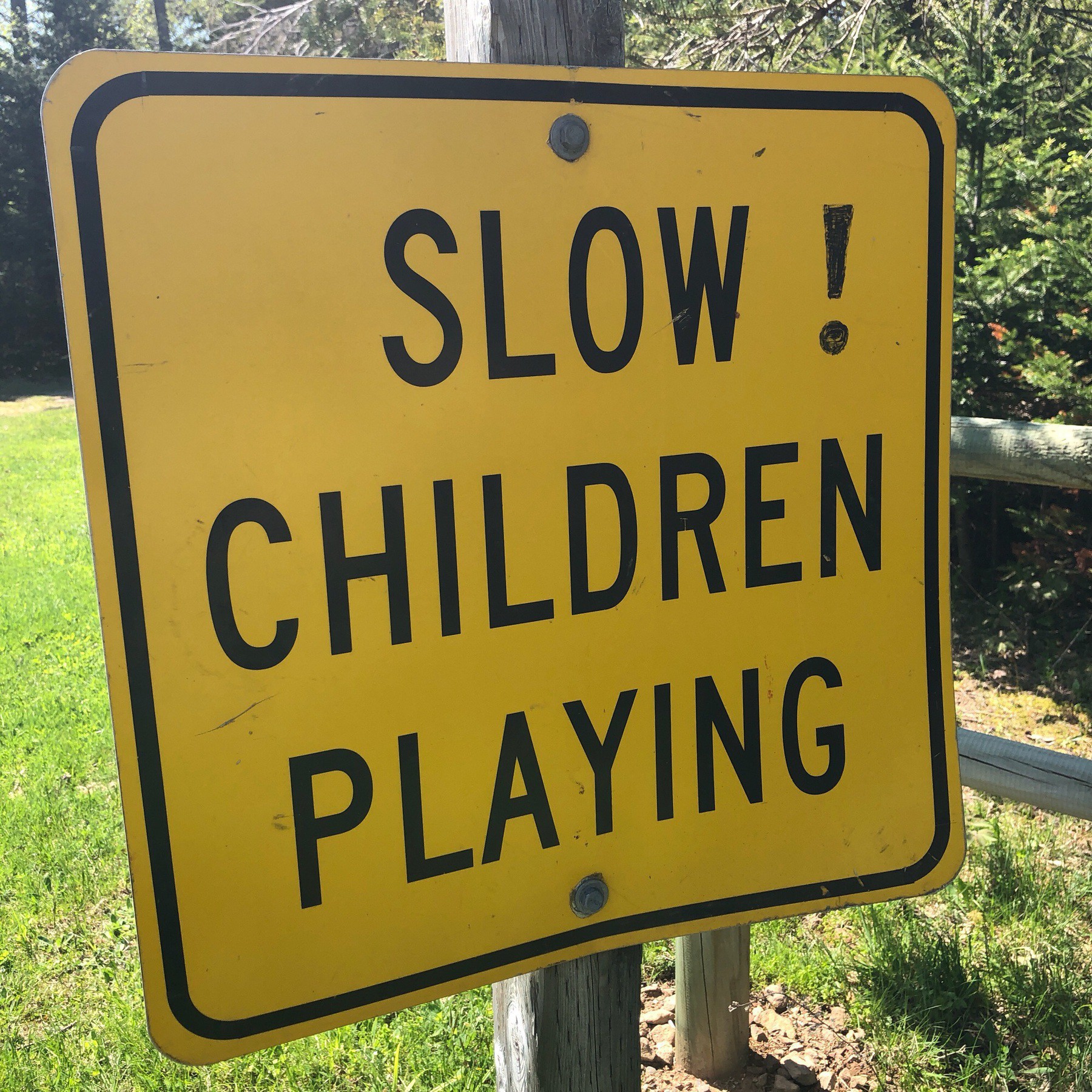 Sign saying "Slow! Children playing."