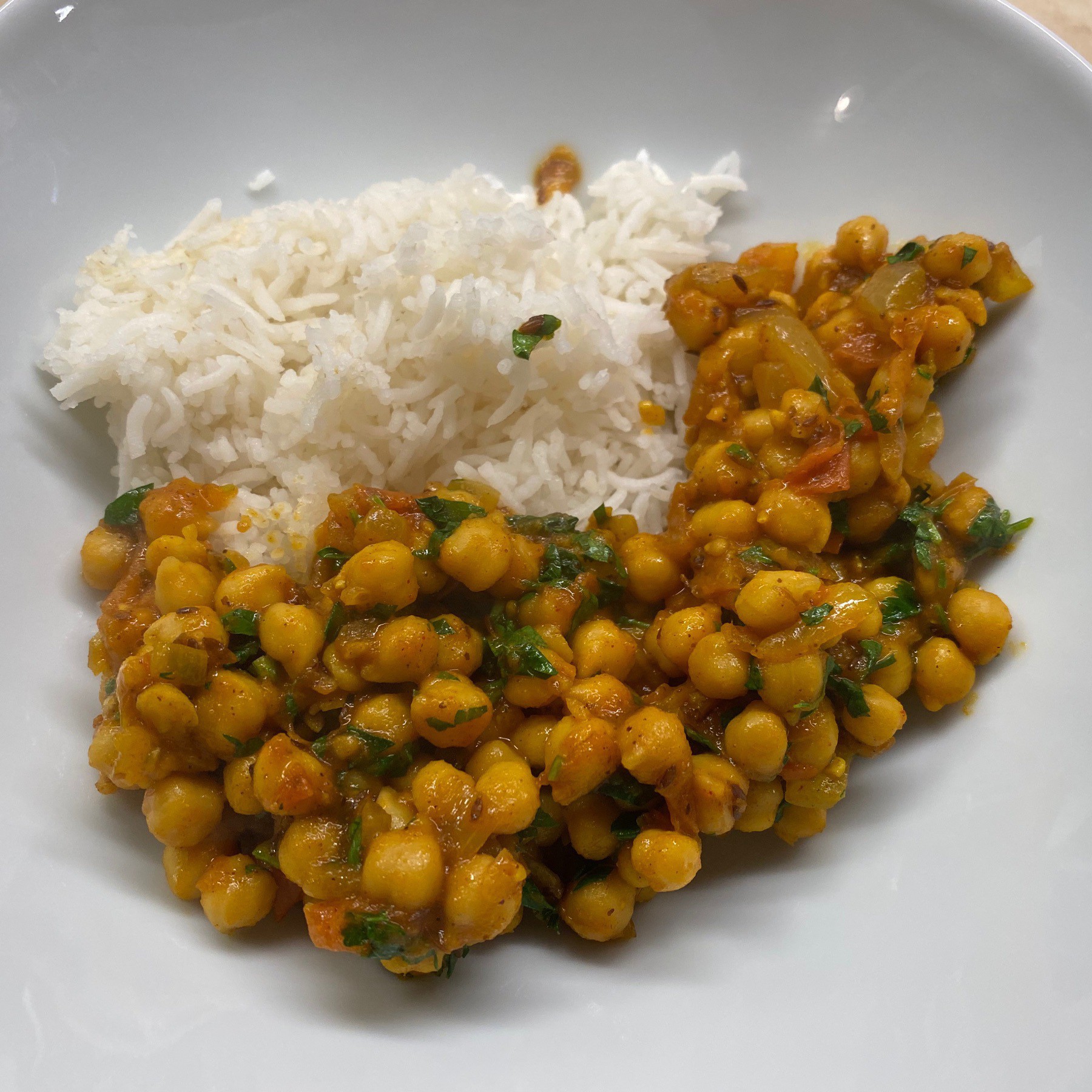 Chickpea curry and rice in bowl.