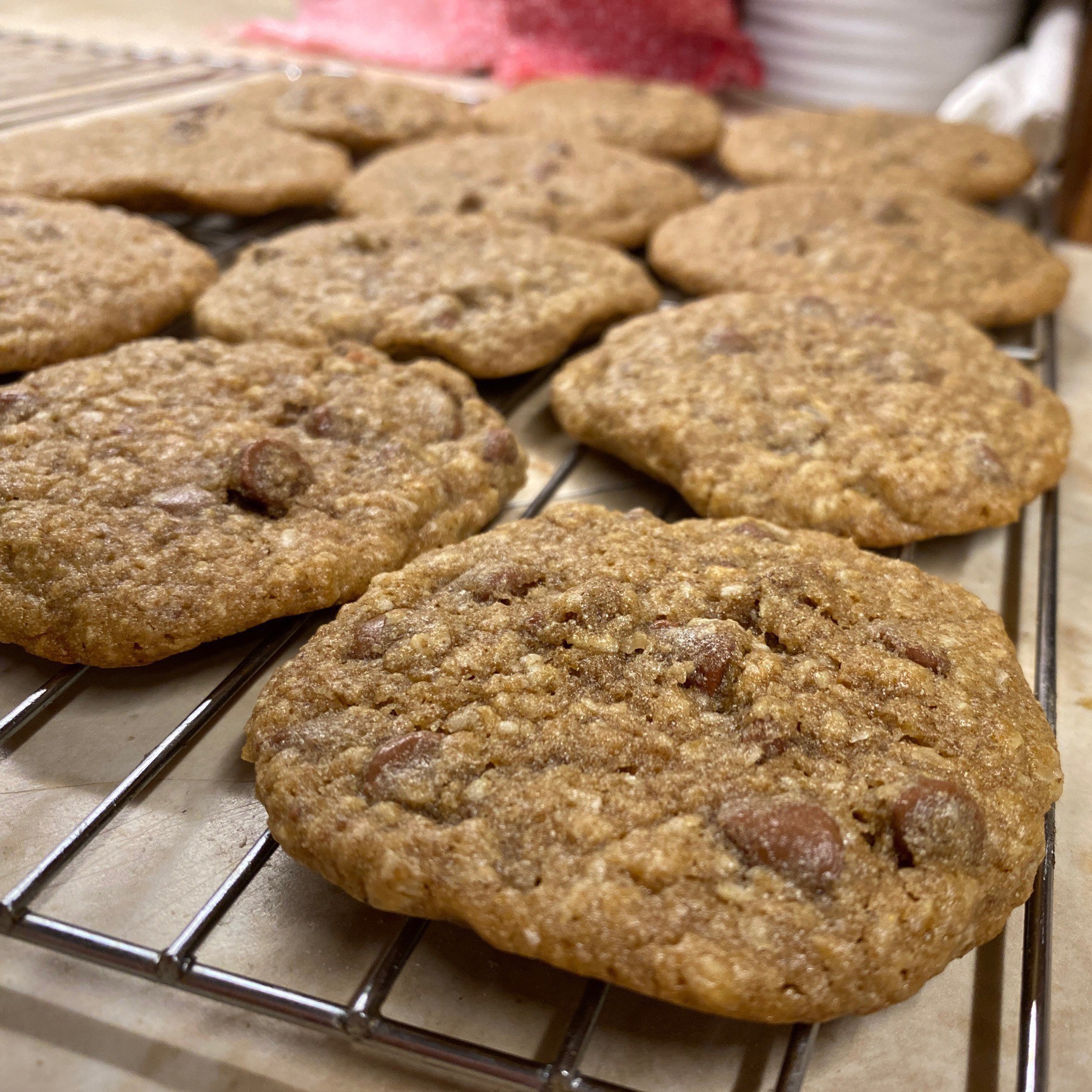 Chocolate chip cookies on rack.