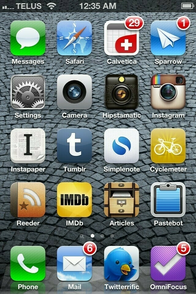 iPhone screenshot of a Home Screen with app icons in a grid. 