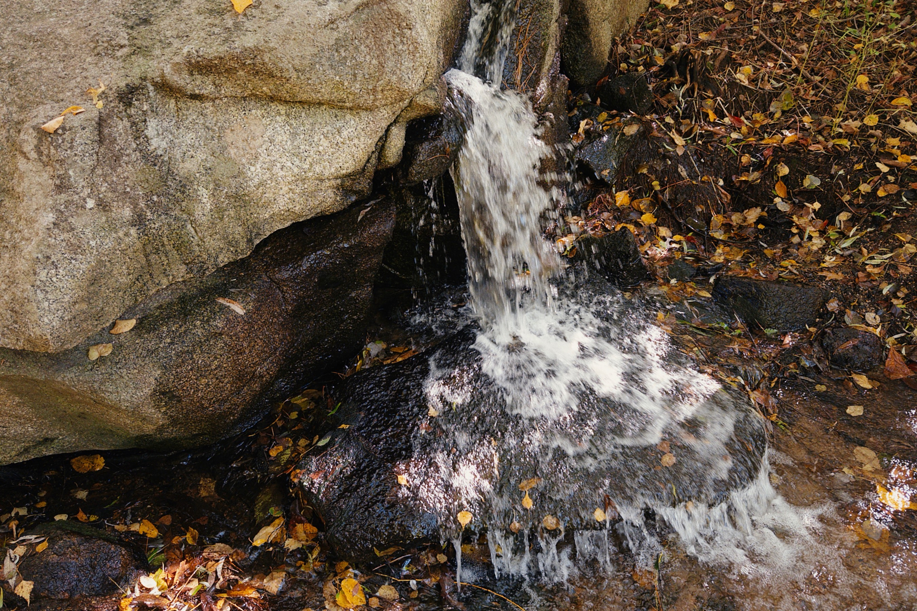 Water falling over rocks and flowing down.