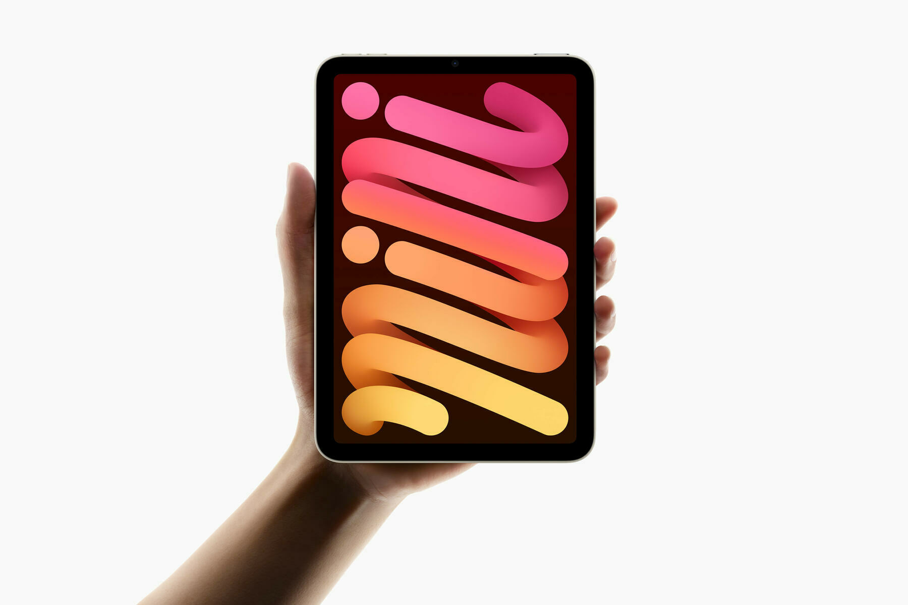 Auto-generated description: A hand is holding a tablet with a colorful screen displaying the word mini.