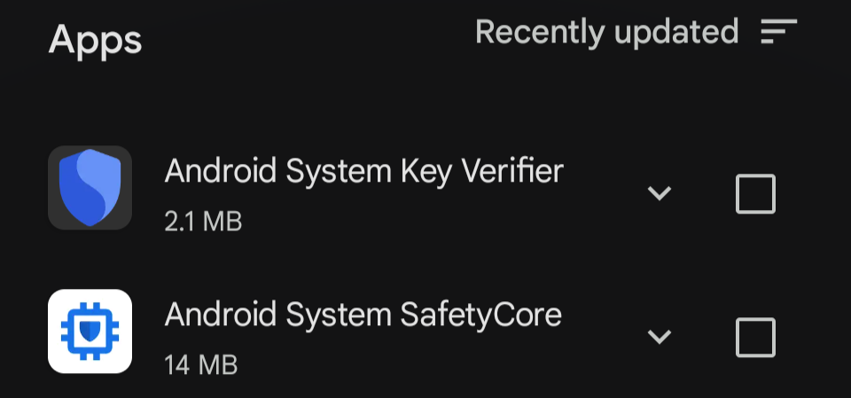 Auto-generated description: A list of two recently updated apps, Android System Key Verifier and Android System SafetyCore, with their icon, size, and a dropdown arrow is displayed.