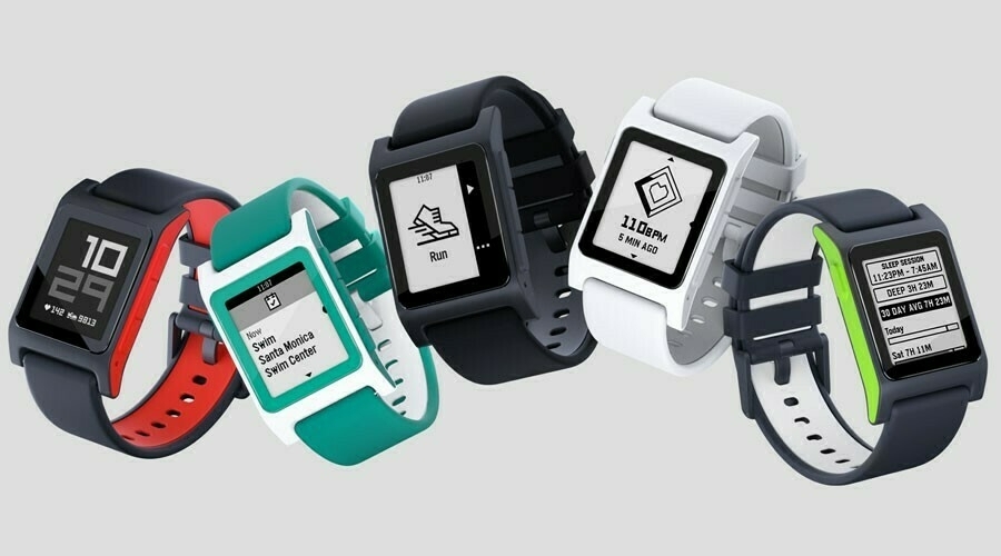 Auto-generated description: Four smartwatches with different colored bands display various screen interfaces, including time, fitness data, and notifications.