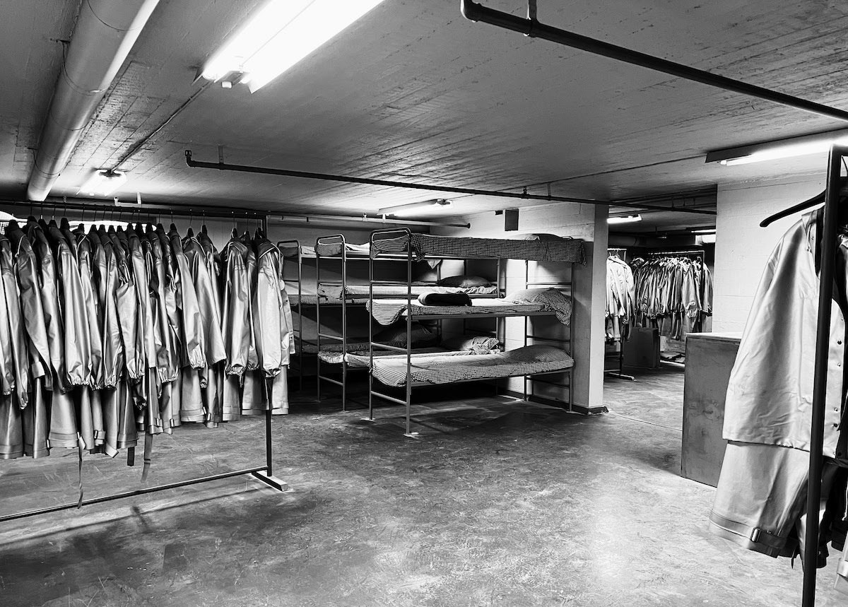 radiation suits and bunk beds in a disused basement bunker