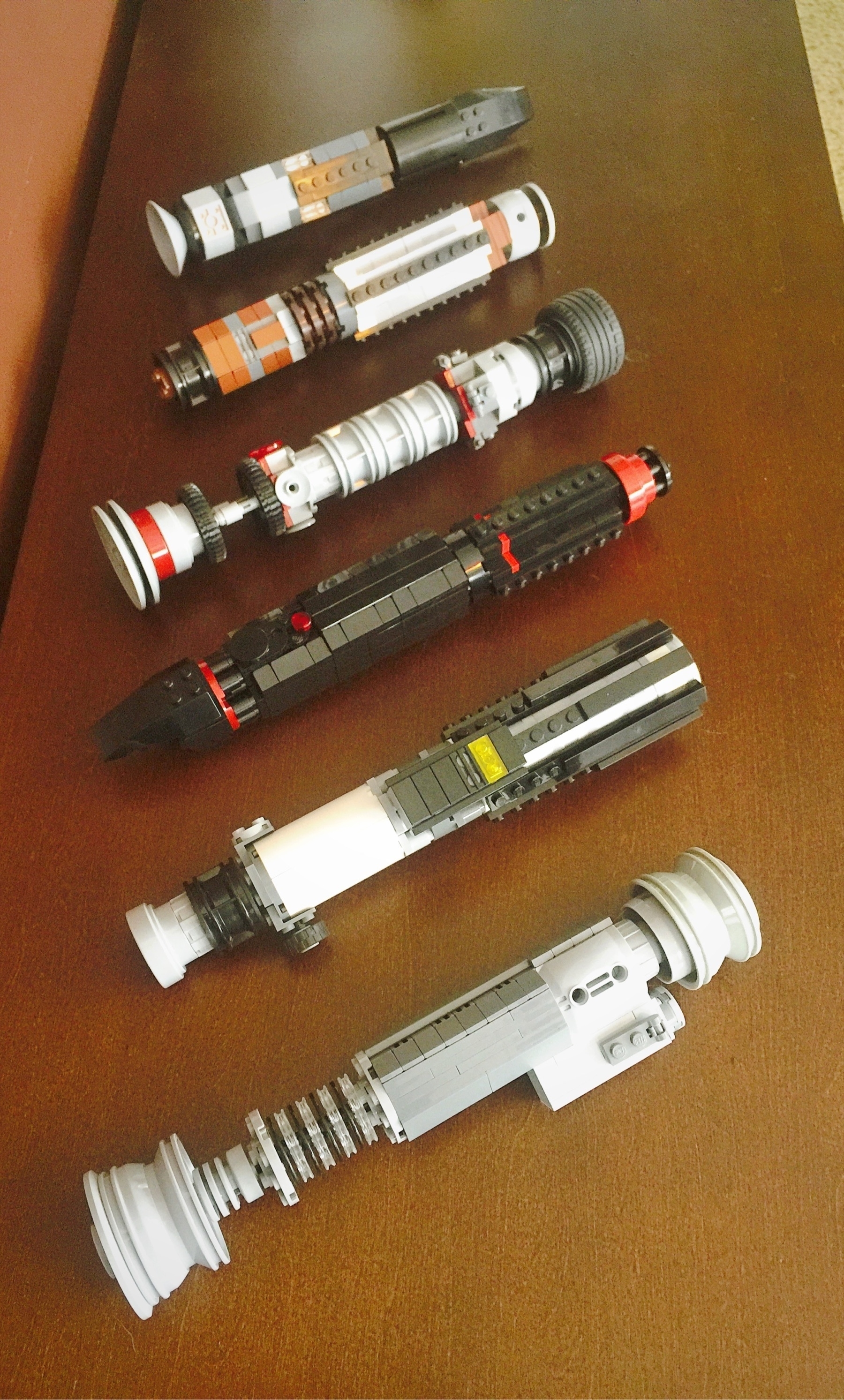 six varied LEGO light sabers