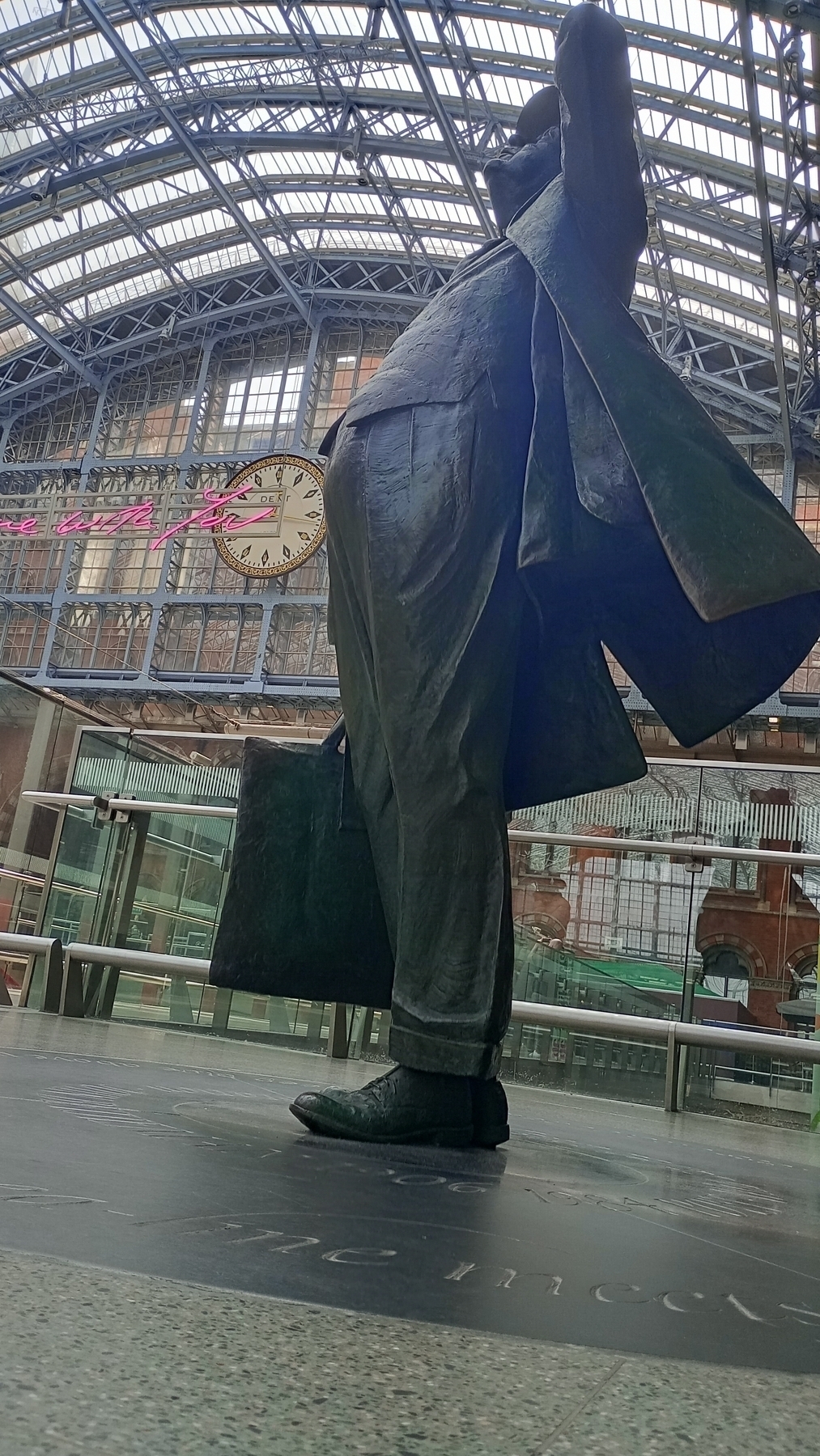 John Betjeman looking up at the glass roof of St Pancras station