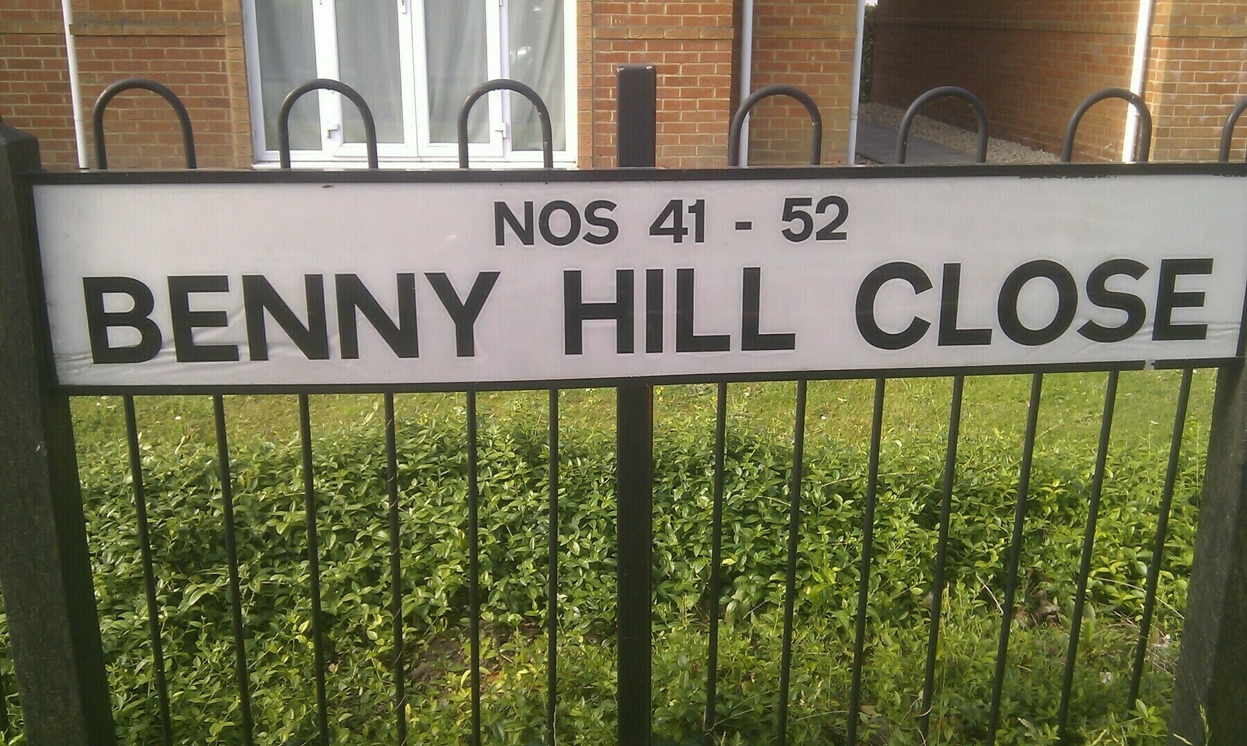 Road sign of Benny Hill Close