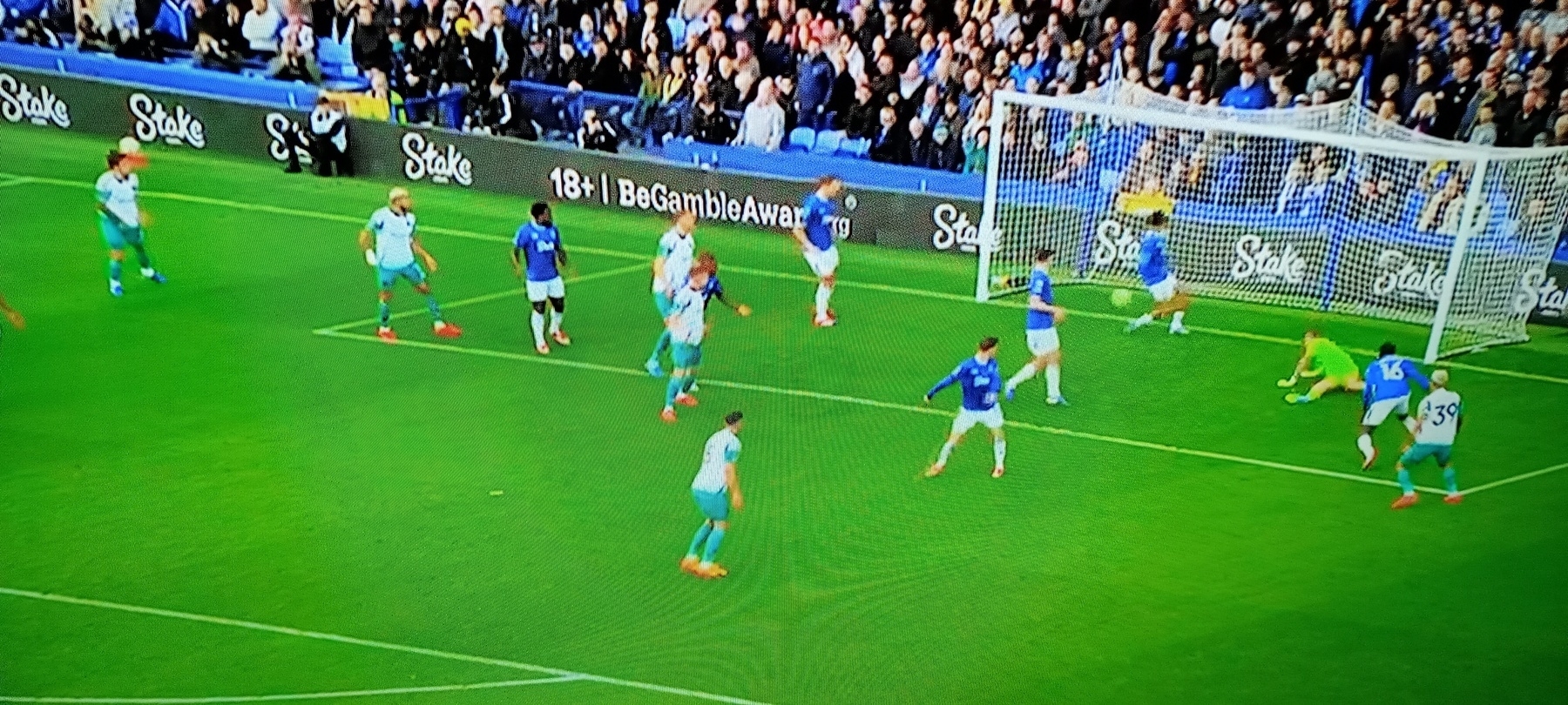 Newcastle playing in their away kit, which looks like it's in Saudi colours