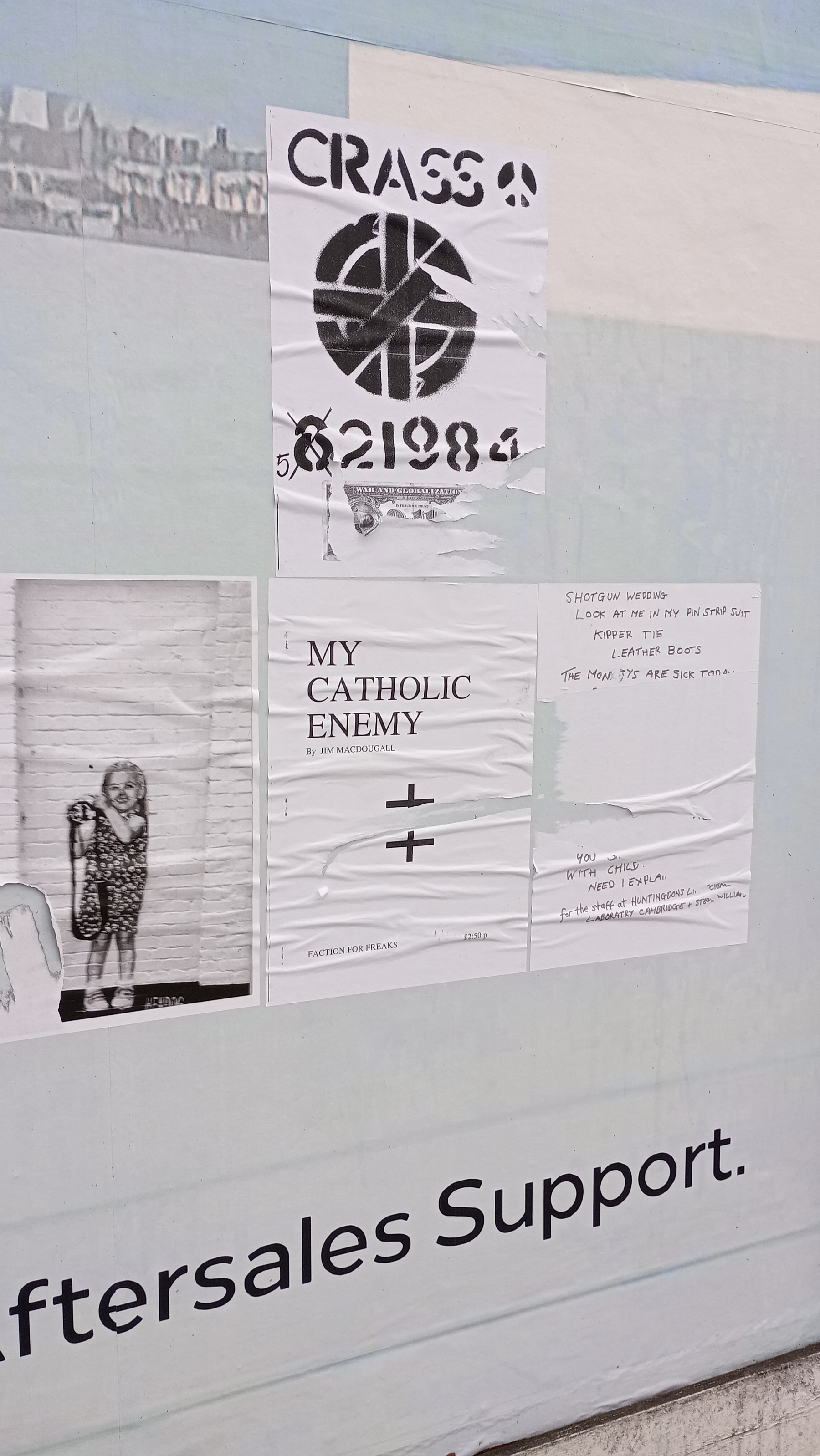 Flyposters of a Crass symbol, something called 'My Catholic Enemy'' and something that looks Bansky-ish