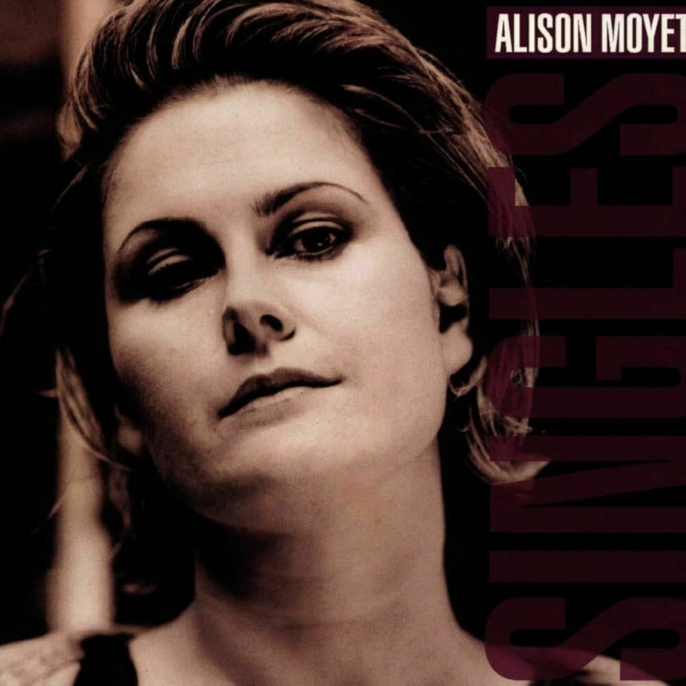 A monochrome image features a woman looking directly at the camera, with the text Alison Moyet and Singles displayed vertically.