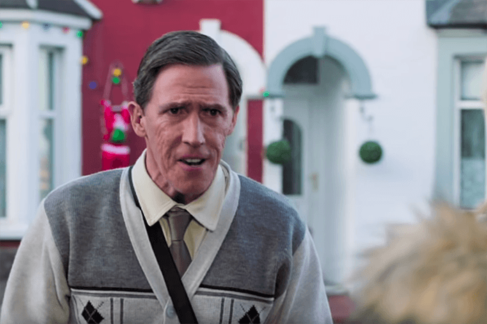 A man in a cardigan is standing outside in front of a house decorated with Christmas lights.&10;&10;The man is Uncle Bryn, from Gavin and Stacey. He explains his name by saying 'it means "hill" in Welsh'