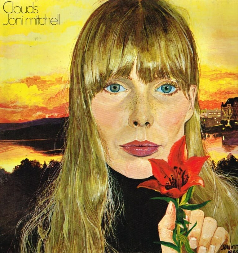 A portrait of a woman holding a red lily is set against a vibrant sunset background, alongside the words Clouds Joni Mitchell.