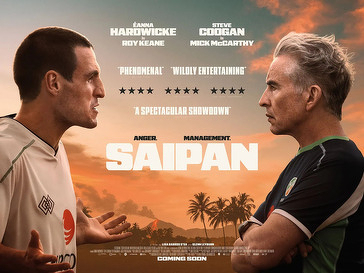 Two men face off against a tropical backdrop, with the text SAIPAN prominently displayed between them.