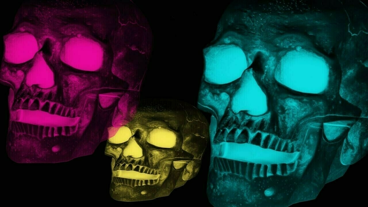 Three human skulls with neon pink, cyan, and yellow hues against a black background, reminiscent of an artistic, radiographic interpretation.