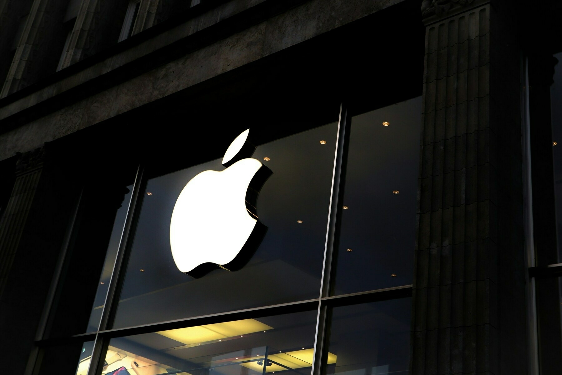 Apple logo over an Apple store