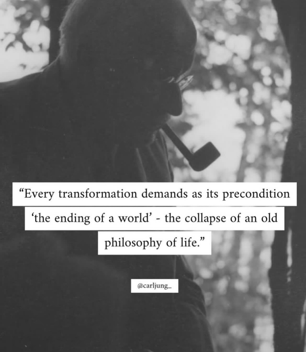 Black and white photo of a man smoking a pipe. In front is a quotation attributed to Carl Jung: "Every transformation demands as its precondition 'the ending of a world' - the collapse of an old philosophy of life."