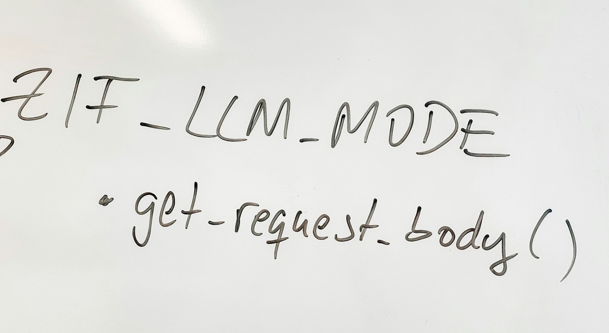 Whiteboard with handwritten text: 'ZIF_LLM_MODE' and 'get-request_body().'