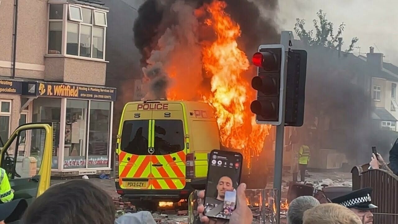 Police van on fire during the 2024 Southport Riots