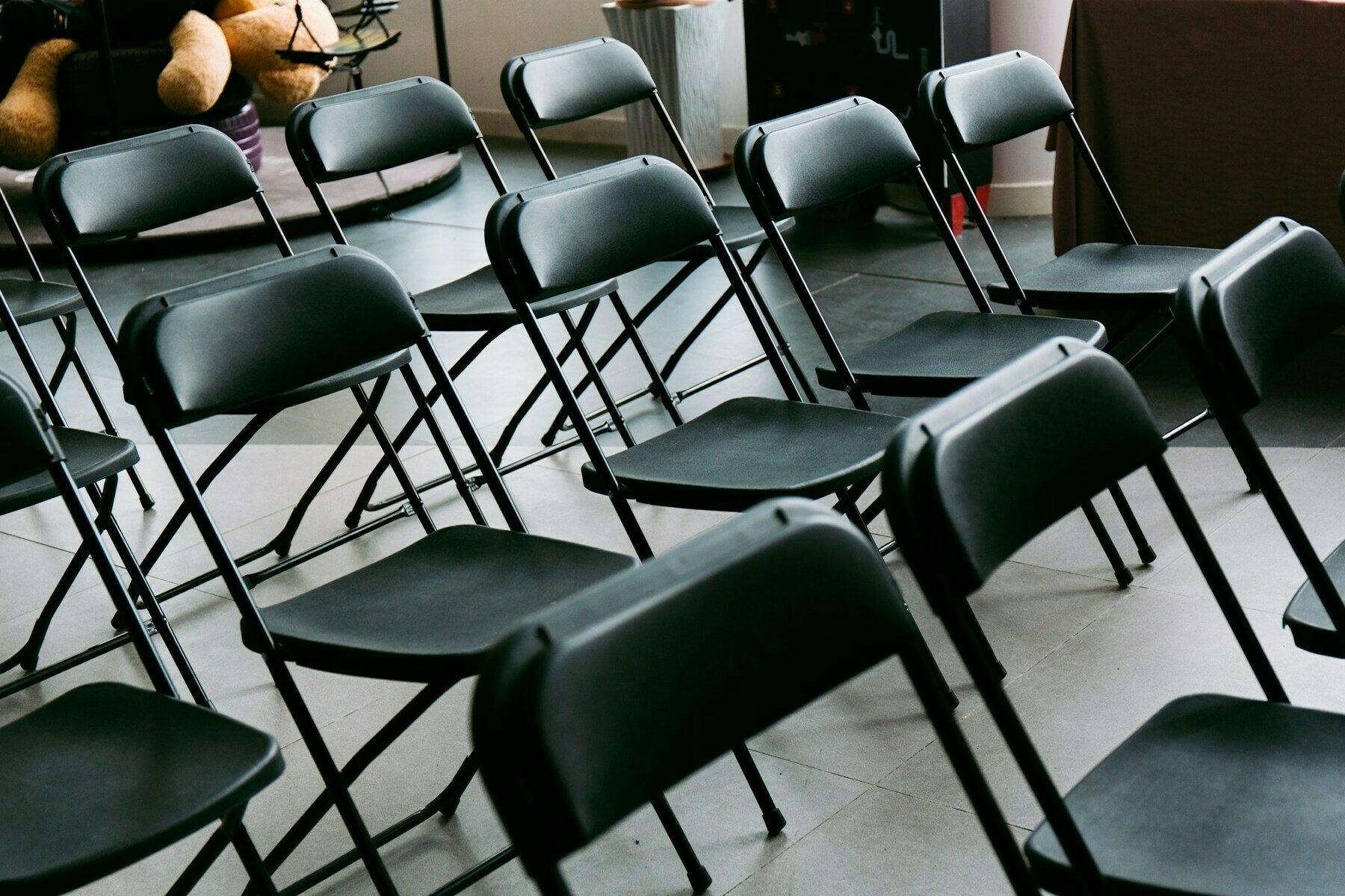 Black folding chairs in rows