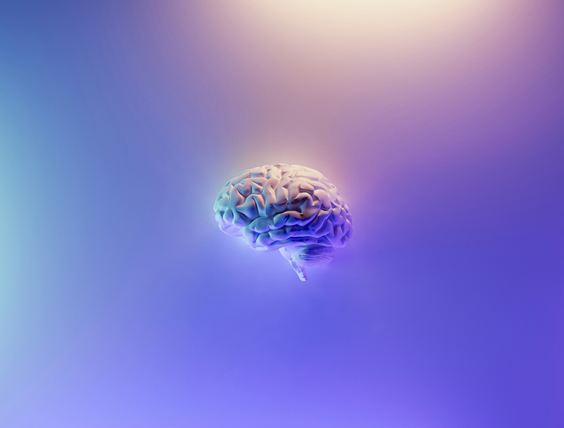 Auto-generated description: A brain is depicted floating against a colorful, abstract background with gradients of purple and blue.