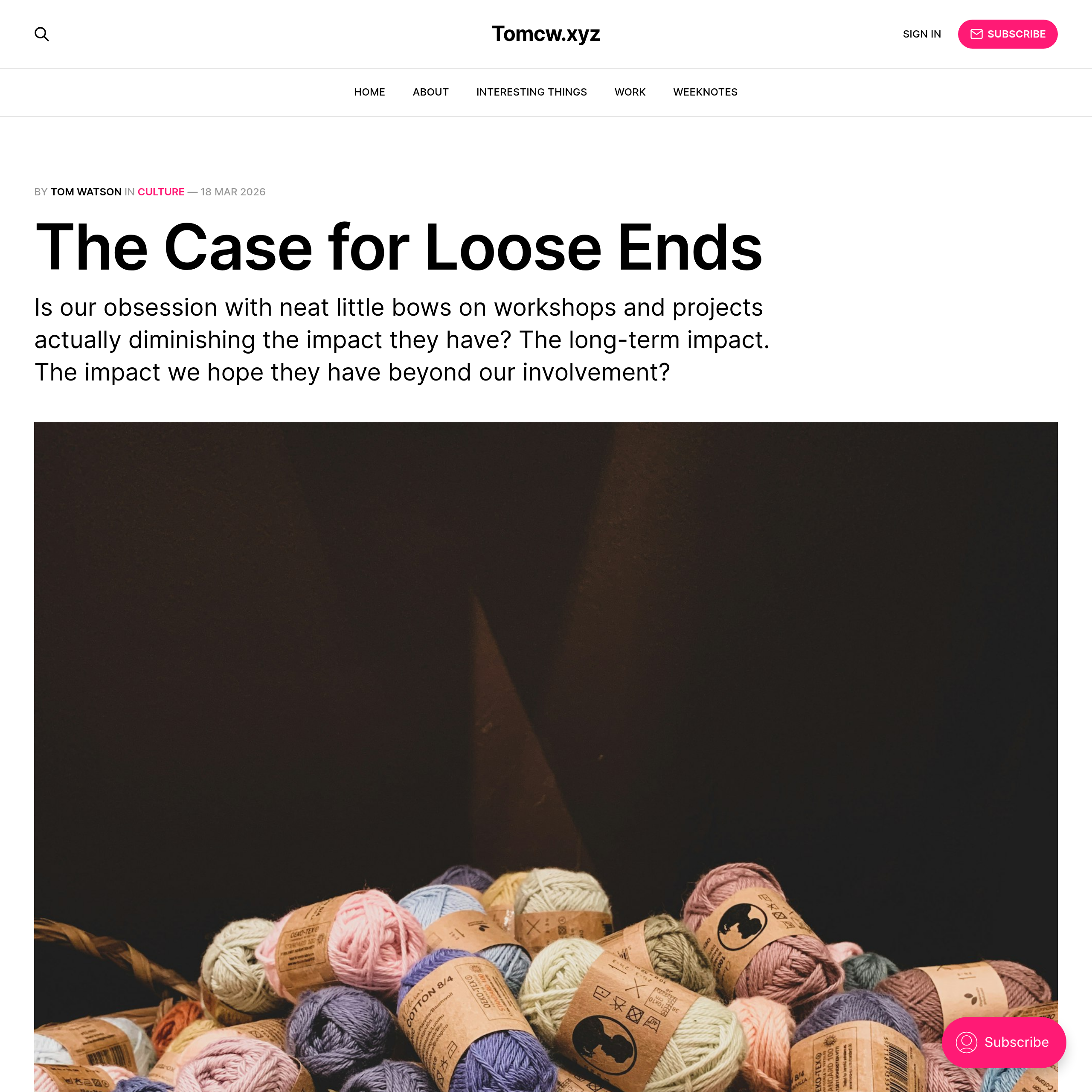 Auto-generated description: A collection of colorful yarn balls is featured below an article titled The Case for Loose Ends on a website.