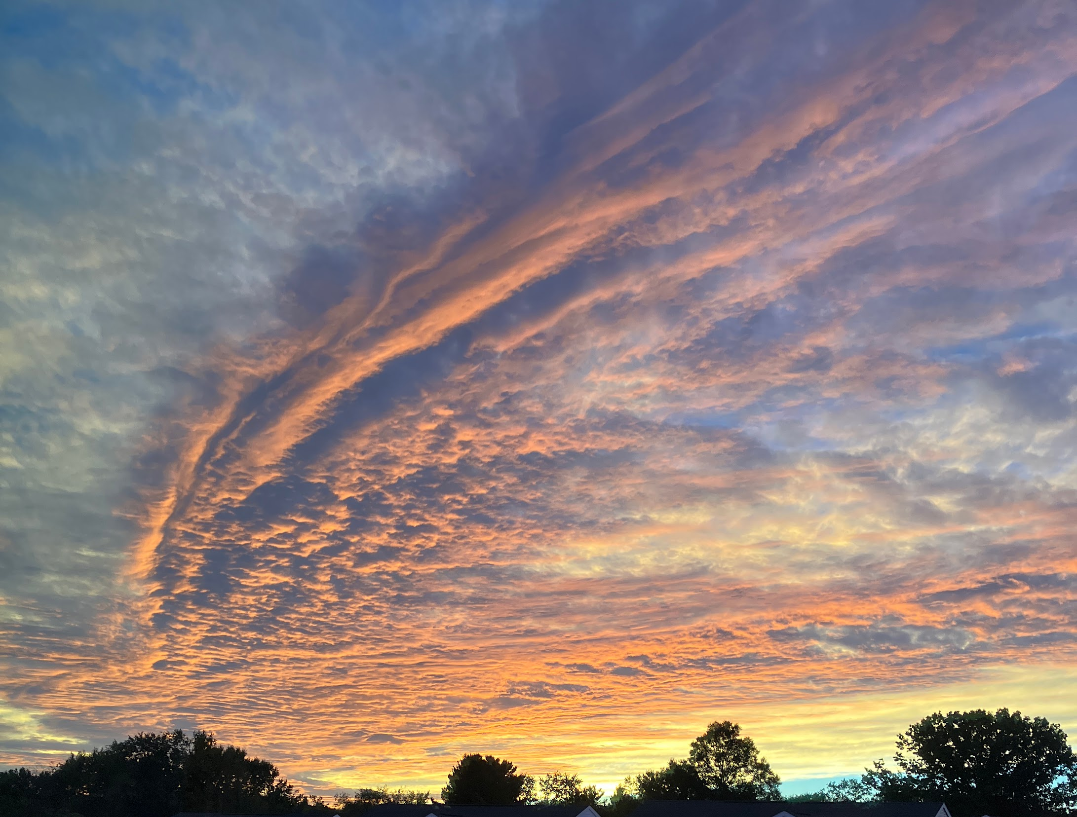 Orange clouds in a pale blue sky