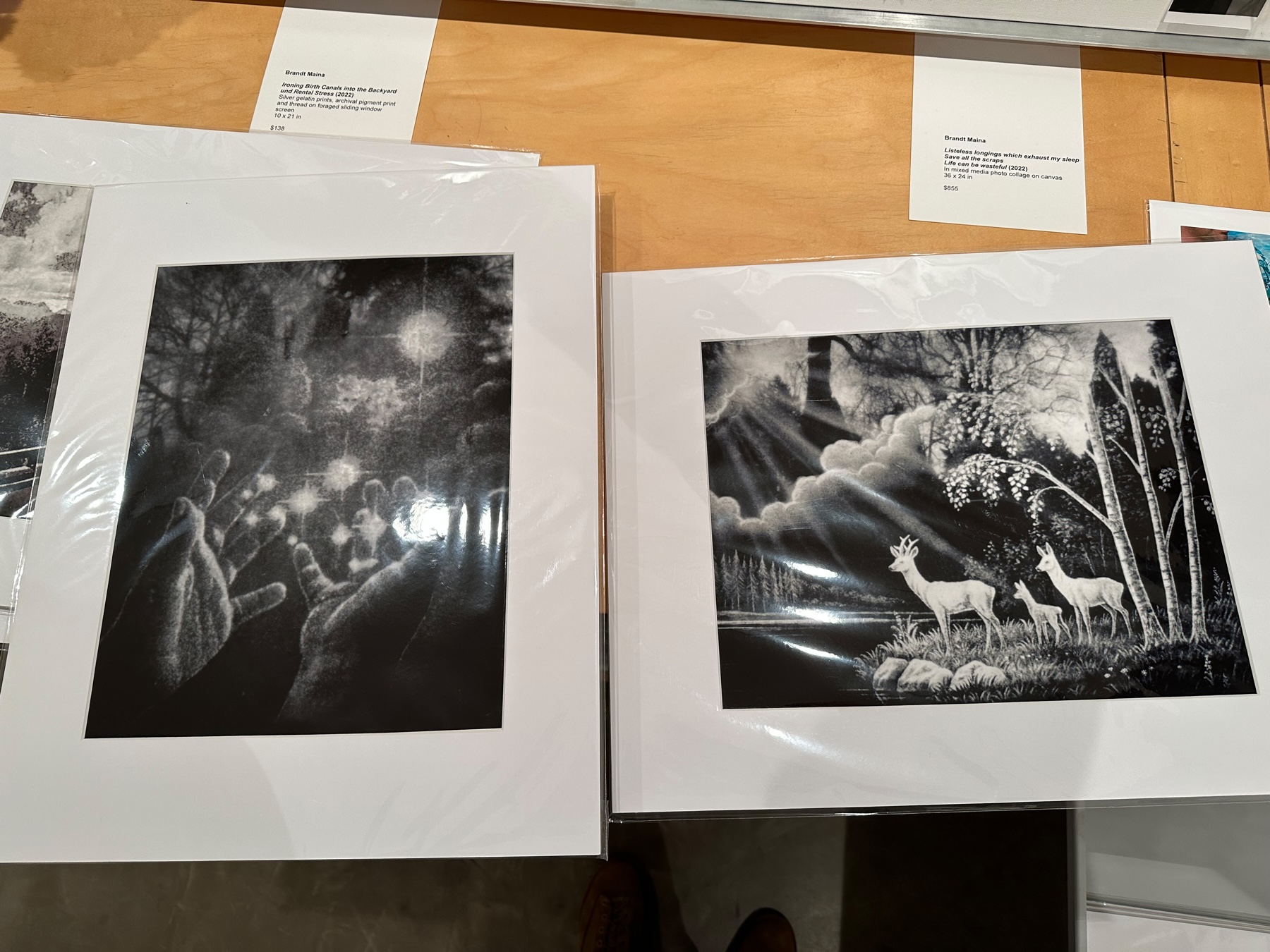 Two black and white matted prints enclosed in a clear plastic envelope.