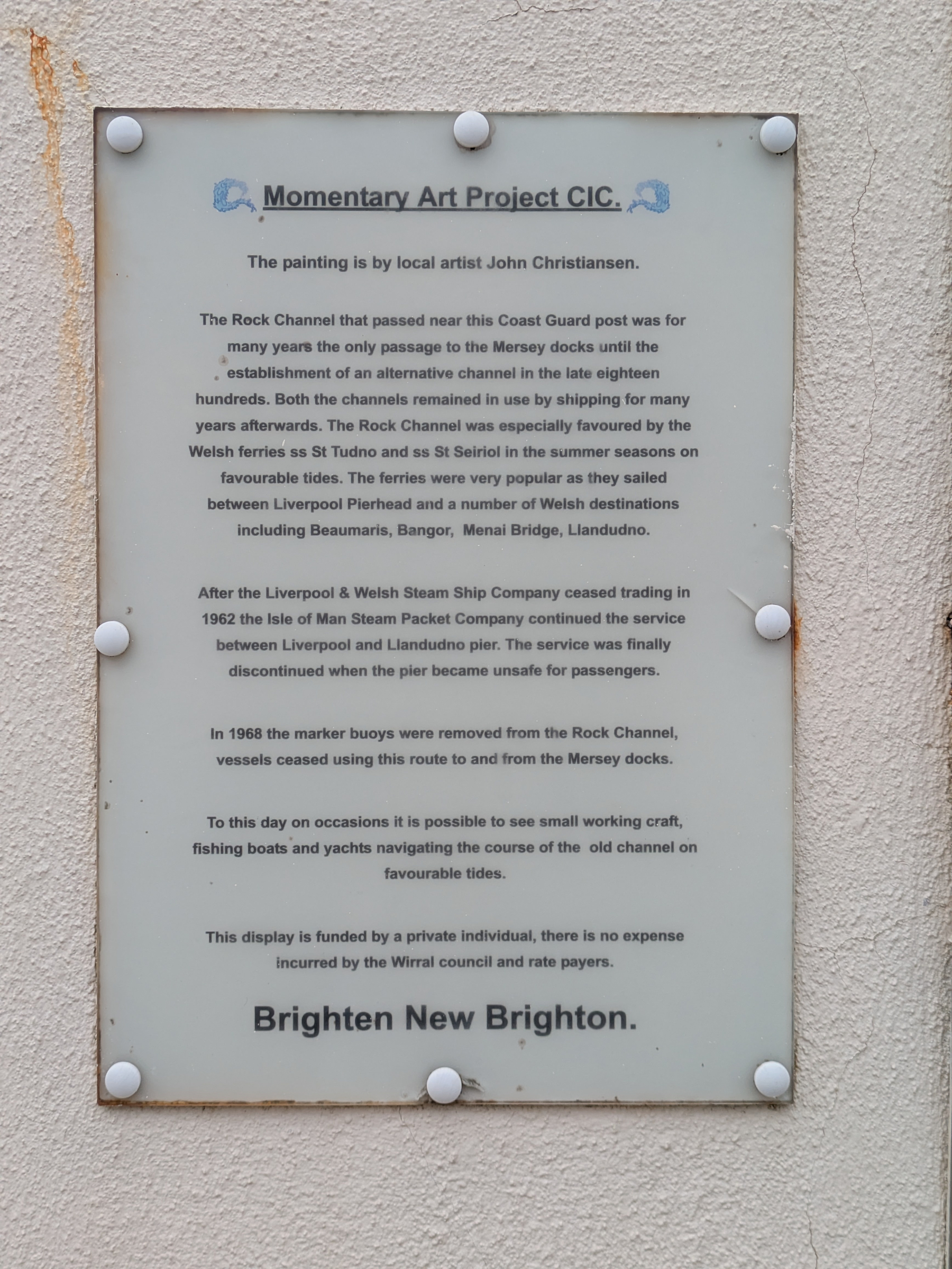 A sign describes an art installation involving the history of the Rock Channel and the activities associated with it, created by local artist John Christiansen.