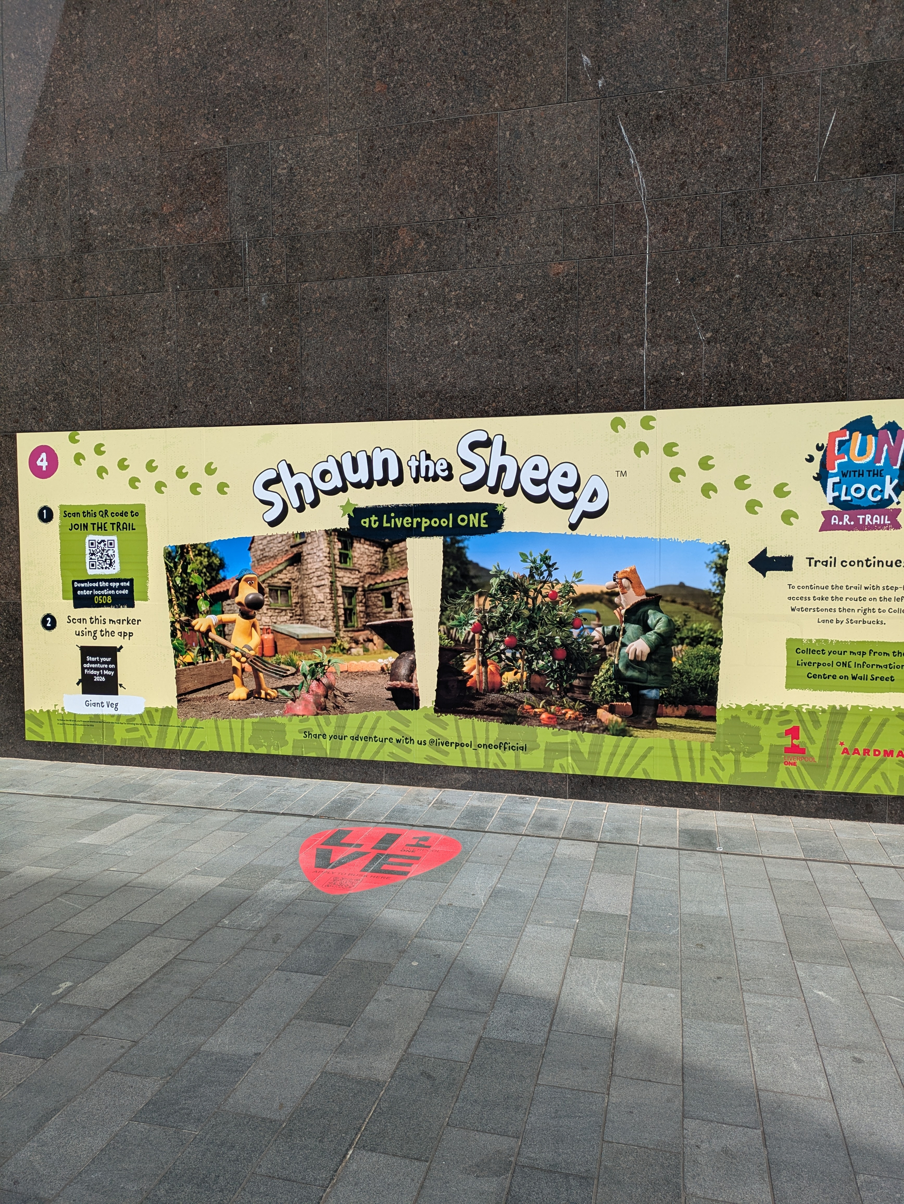 A promotional poster for Shaun the Sheep at Liverpool ONE features images of characters in a garden setting and instructions for a trail activity.