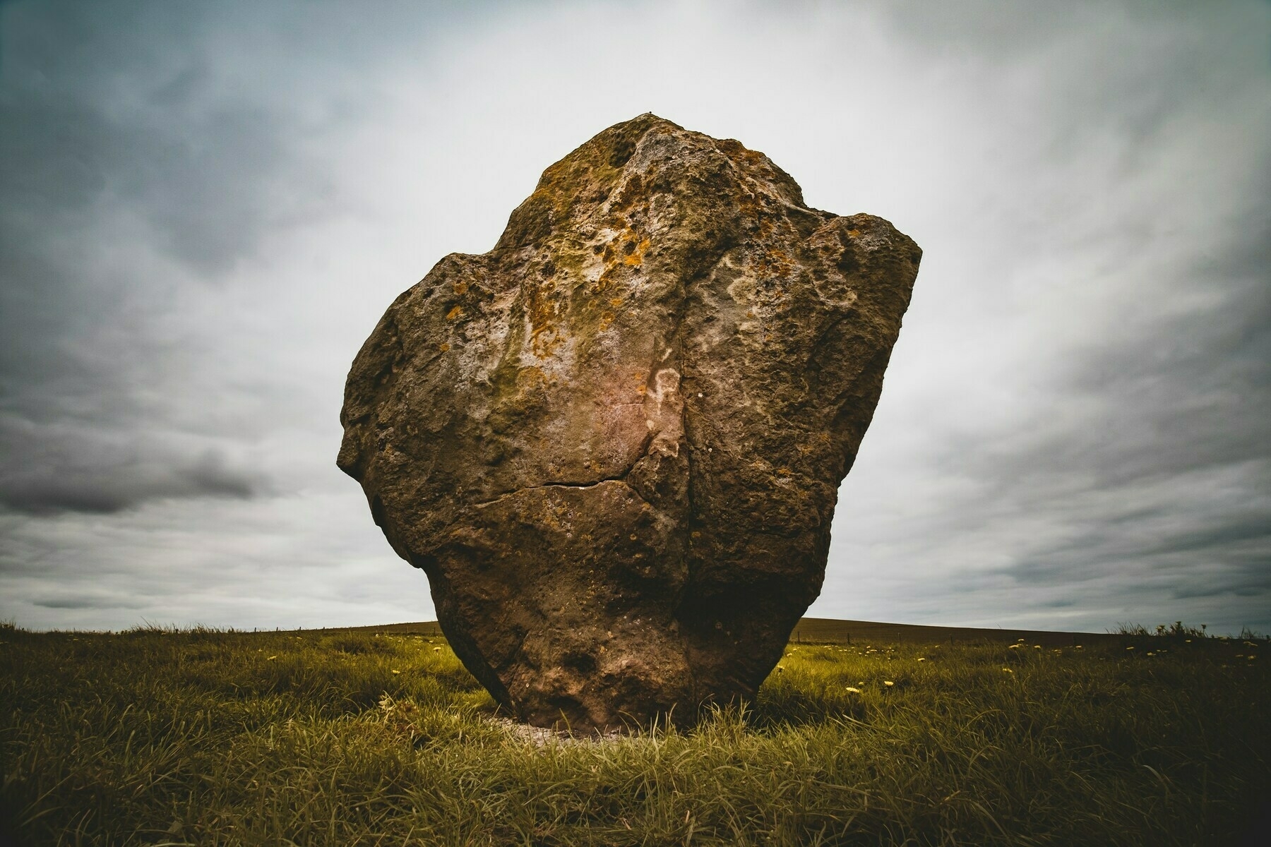 a huge boulder in a field