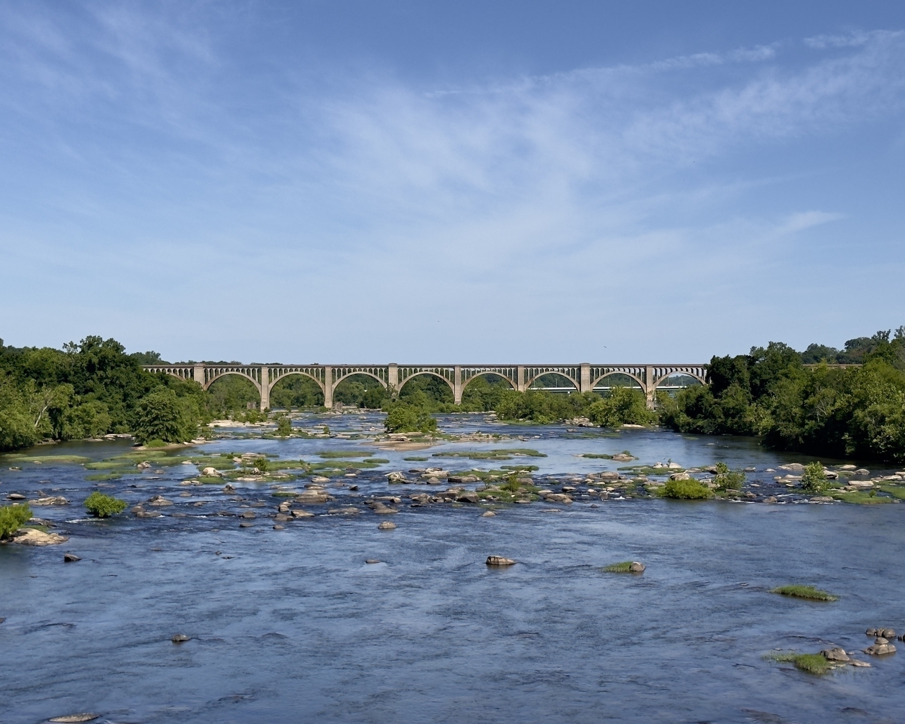 The CSX A-Line Bridge with concrete arches crossing the James River, viewed from the Nickel Bridge in Richmond, VA