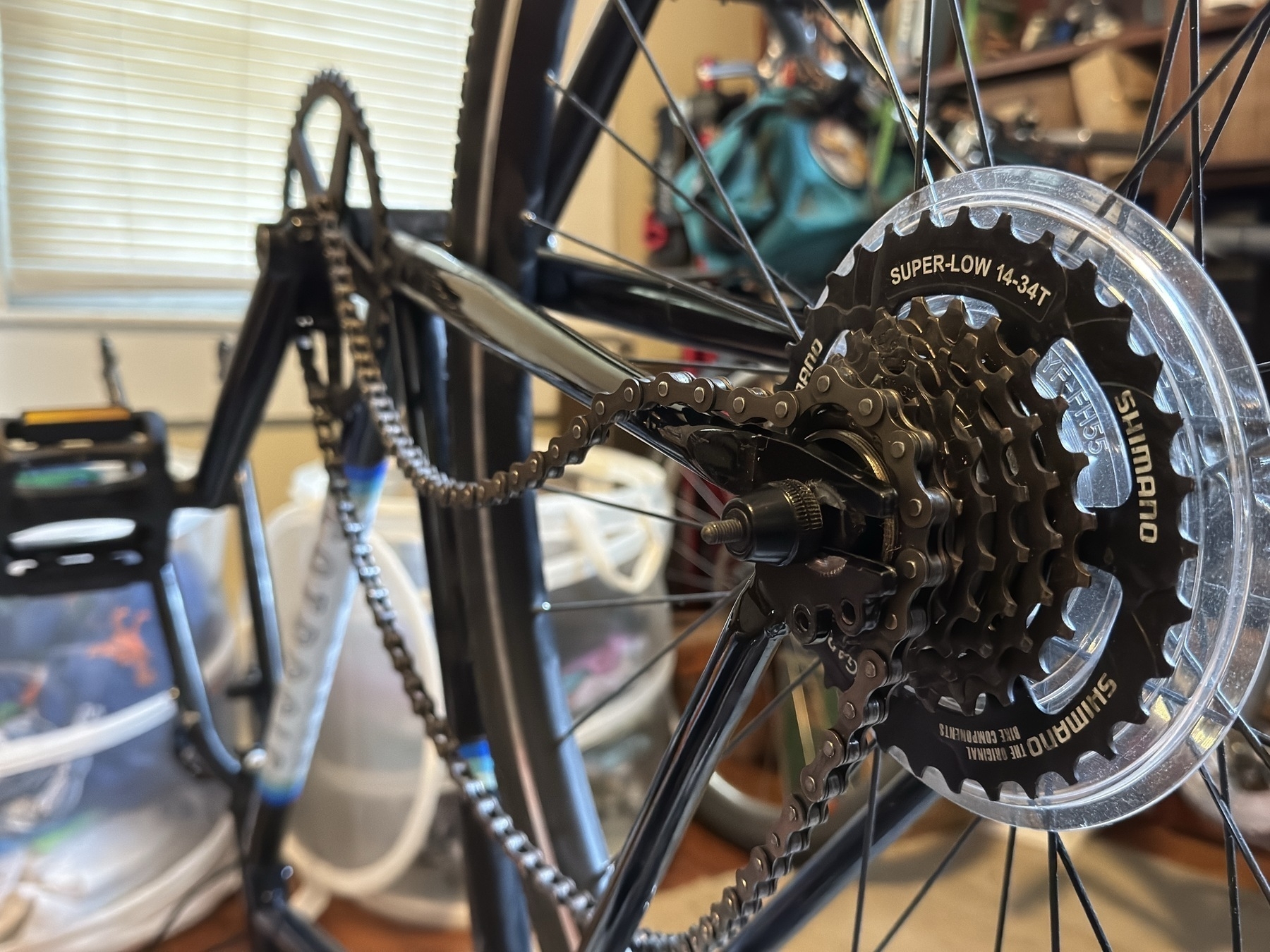 a wheel with a multi-gear cassette sits in the newly widened dropouts of my Fairdale Coaster bike