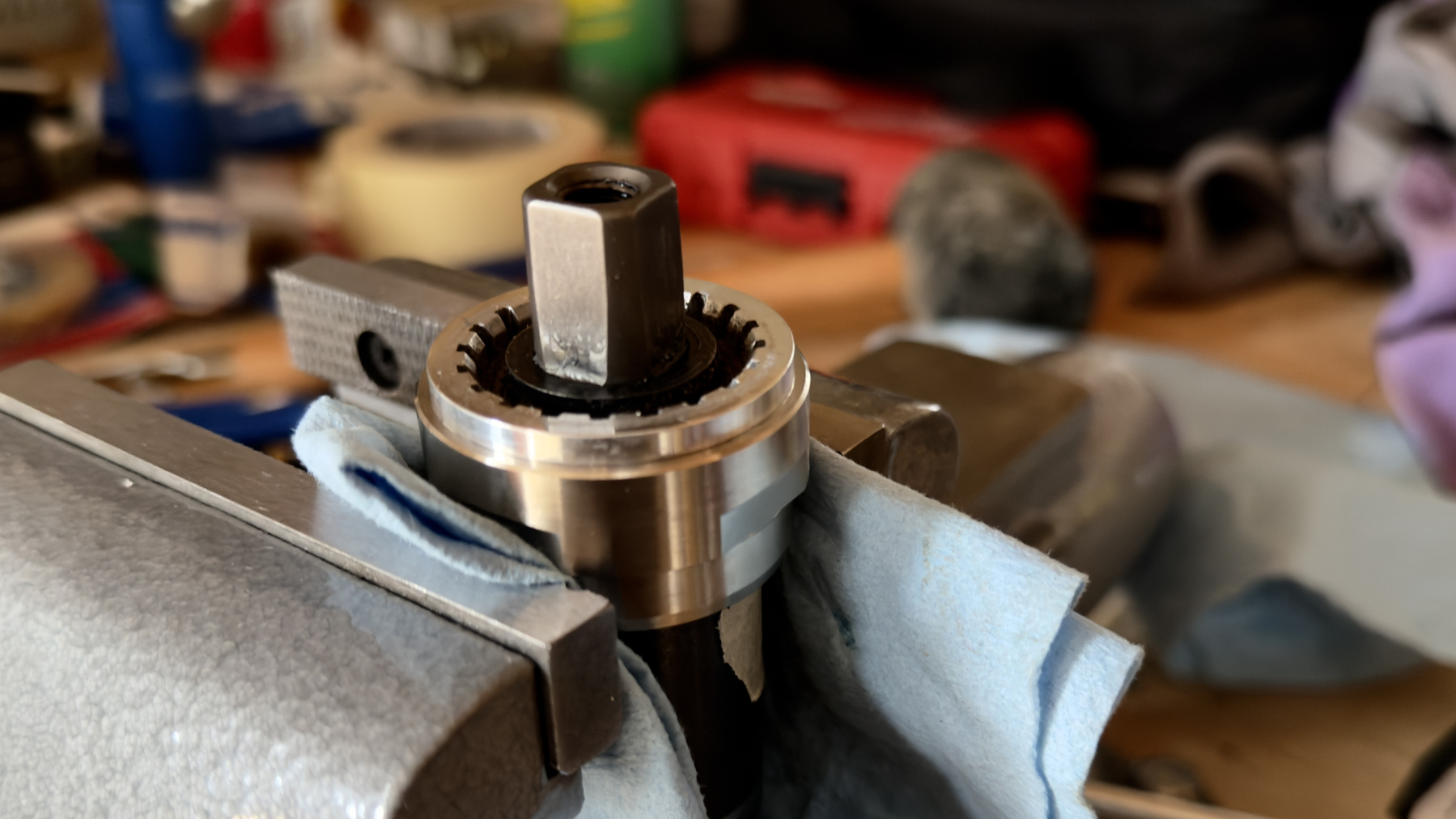 conversion cup held in a vice with bottom bracket threaded in