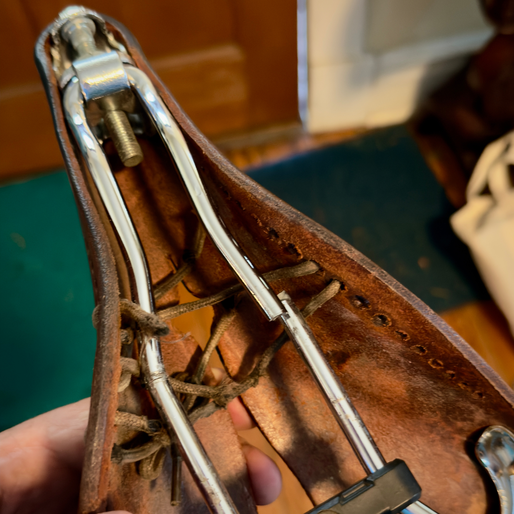 Close up of the underside of my Brooks B17 carved saddle with a cracked rail