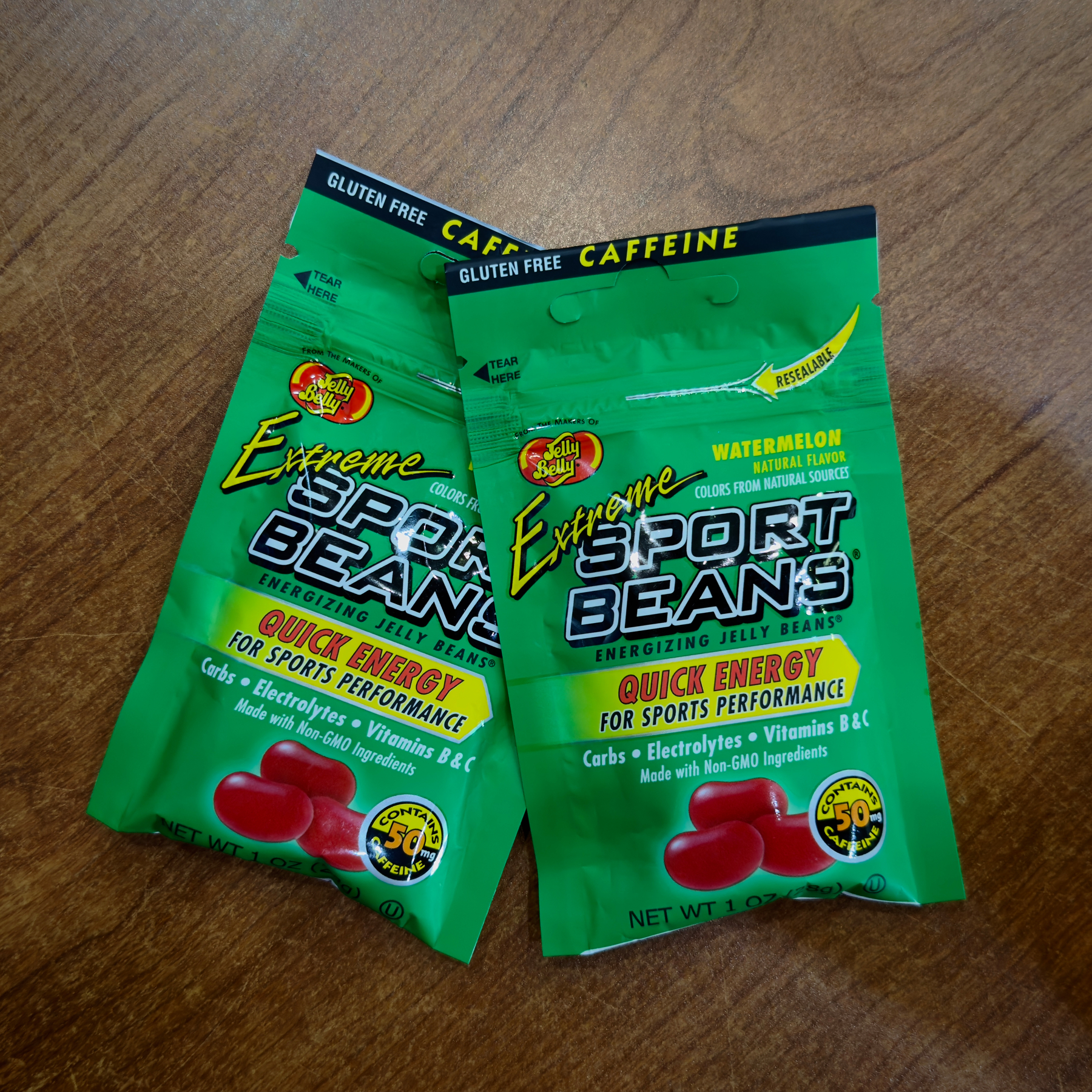 Two packets of Jelly Belly brand “Extreme Sport Beans”—mildly caffeinated, watermelon-flavored “energy” jelly beans with vitamins and electrolytes.