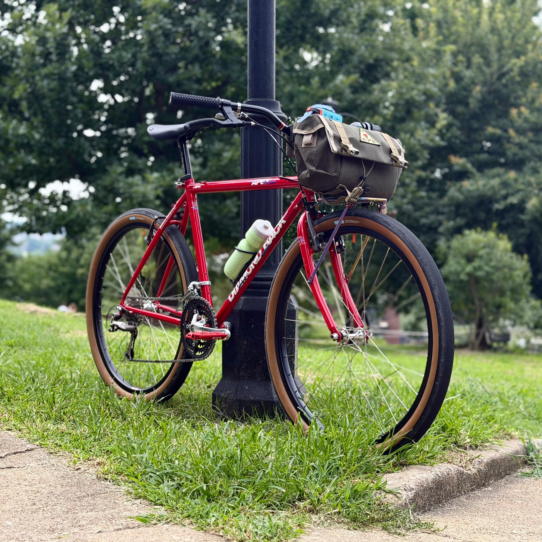 Bicycle leaning against a light pole