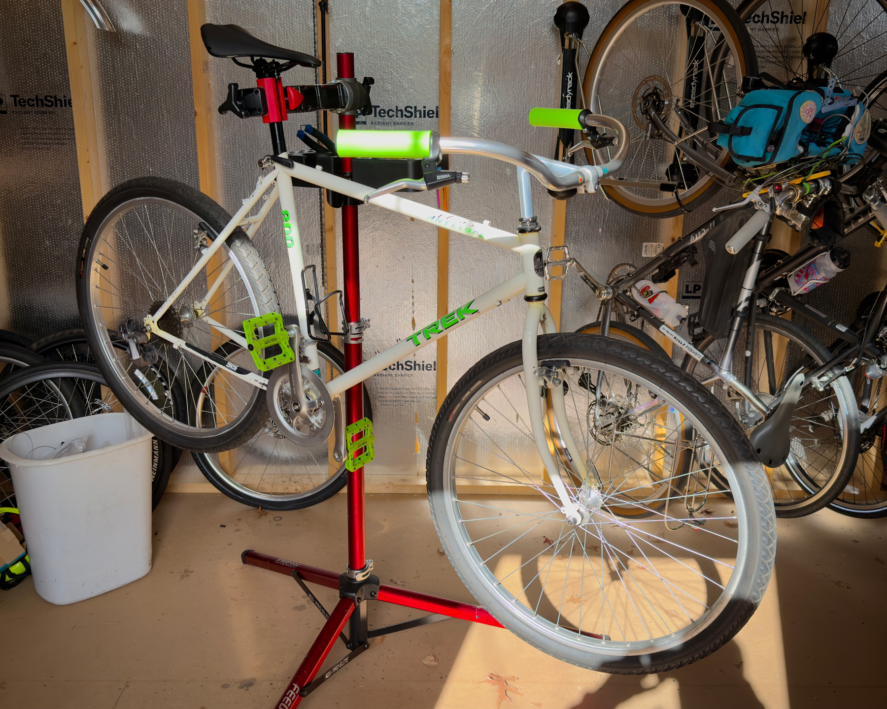 My 1990 Trek Antelope 800 in the stand with Ron's Ortho bars, XTR rear derailleur, and some old cheap pedals that more-or-less match the decals