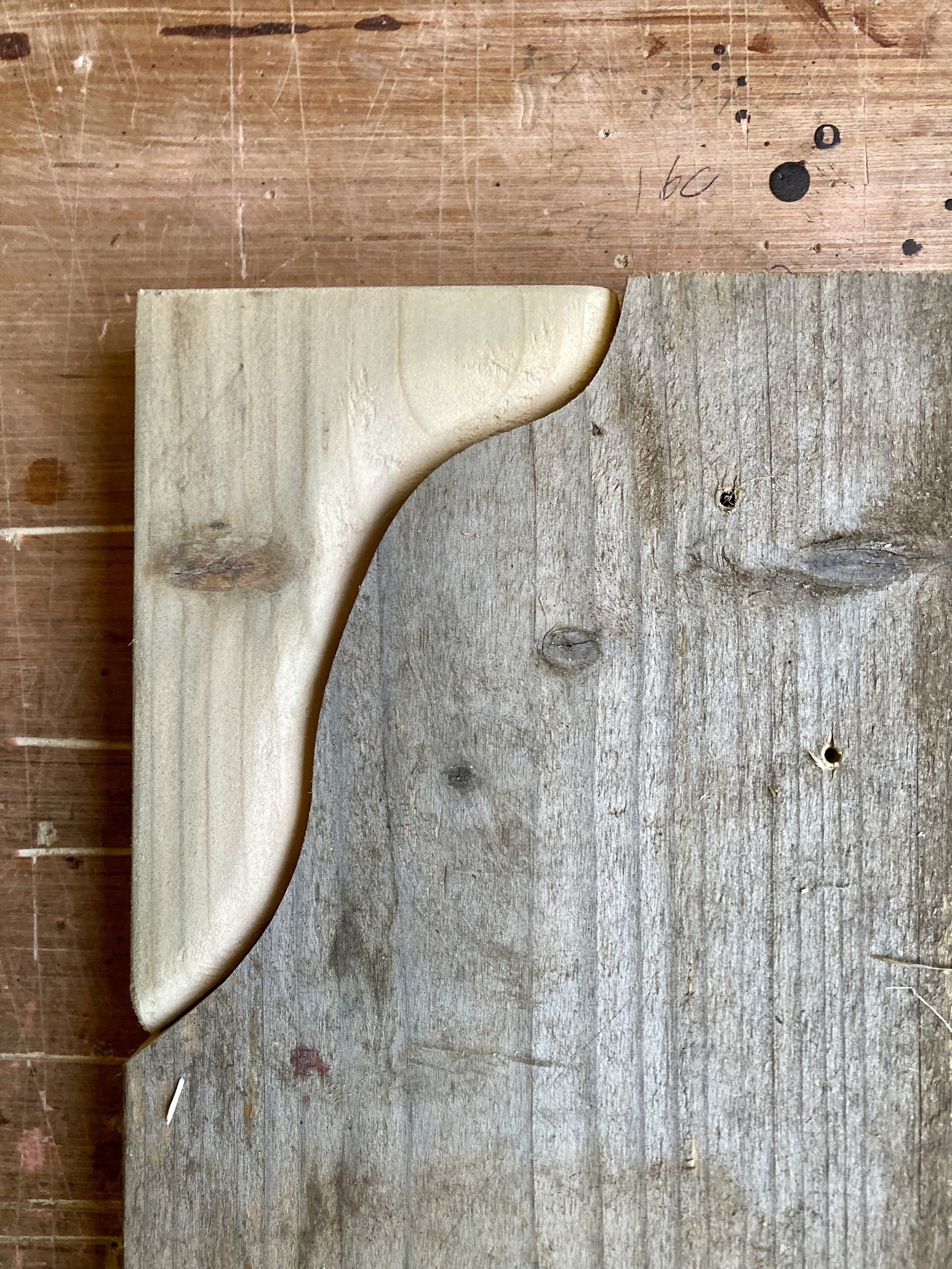 A piece of wood with a corner cut out, sanded, and replaced.