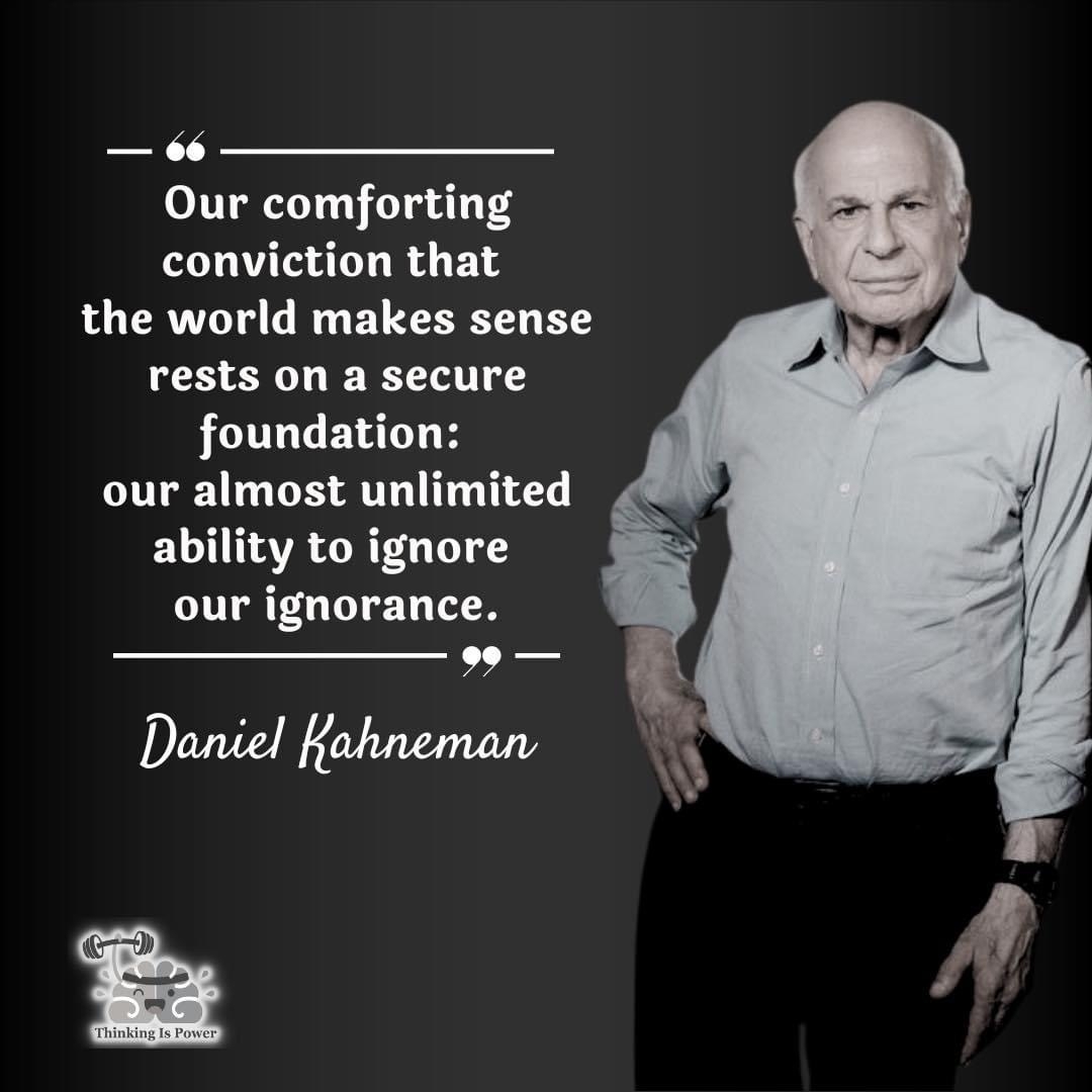 Auto-generated description: A man stands next to a quote attributed to Daniel Kahneman about the human tendency to ignore ignorance, with the design of the image also including a logo and tagline.